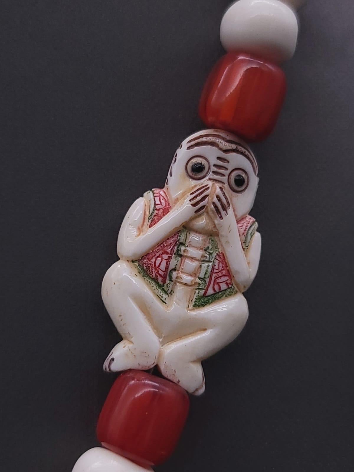 A.Jeschel 3 Wise monkeys in a Long Red Copal necklace  In New Condition For Sale In Miami, FL