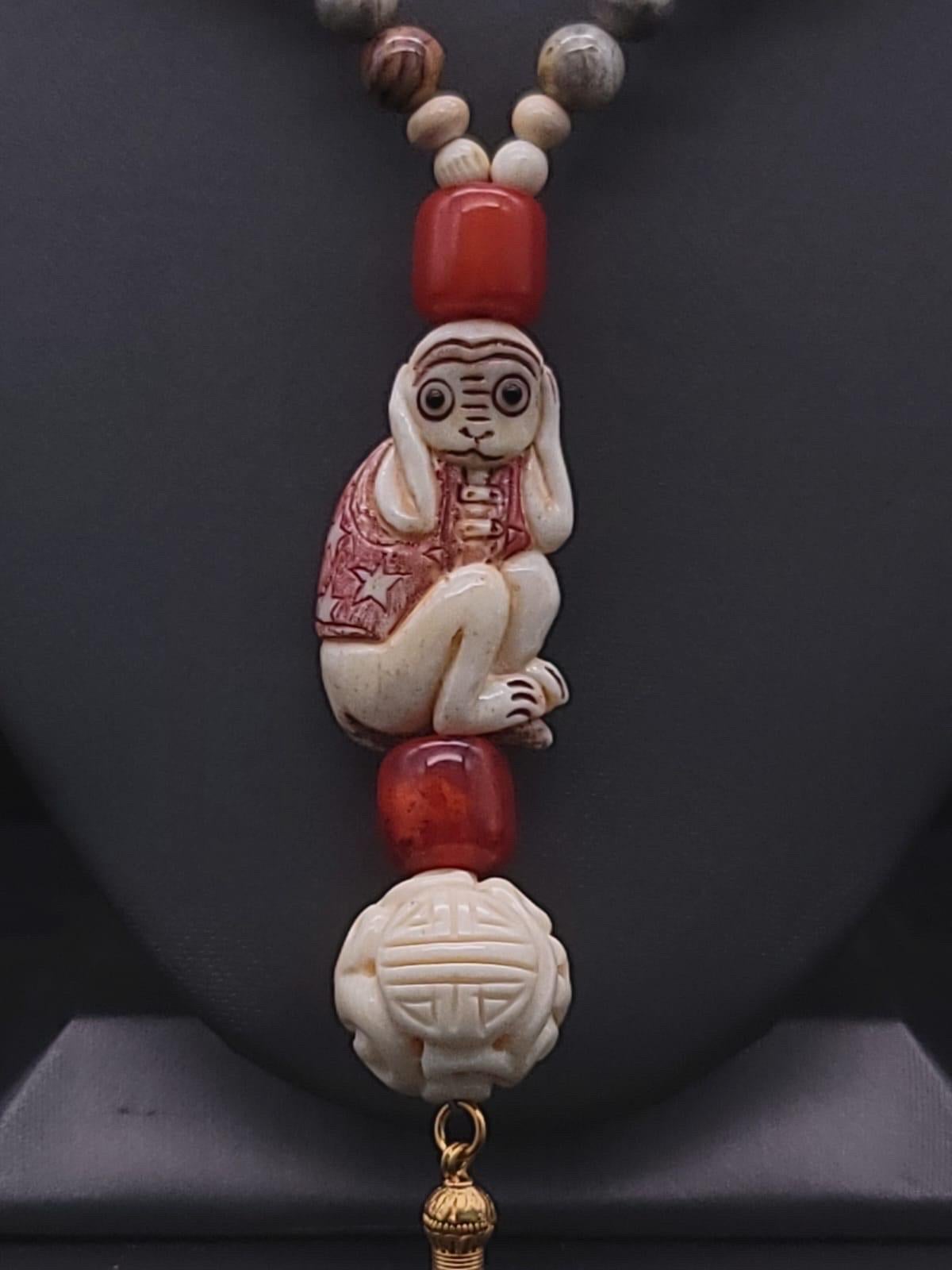 Women's A.Jeschel 3 Wise monkeys in a Long Red Copal necklace  For Sale