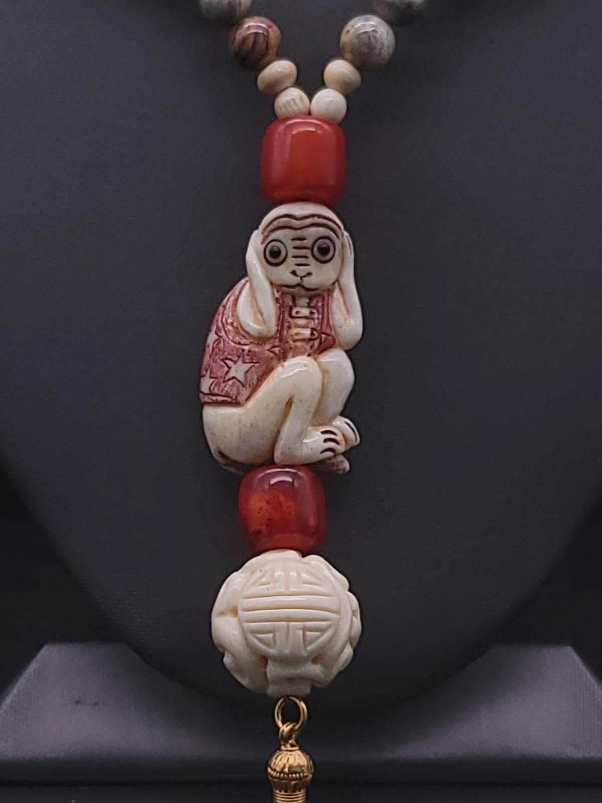 Women's A.Jeschel 3 Wise monkeys in a Long Red Copal necklace