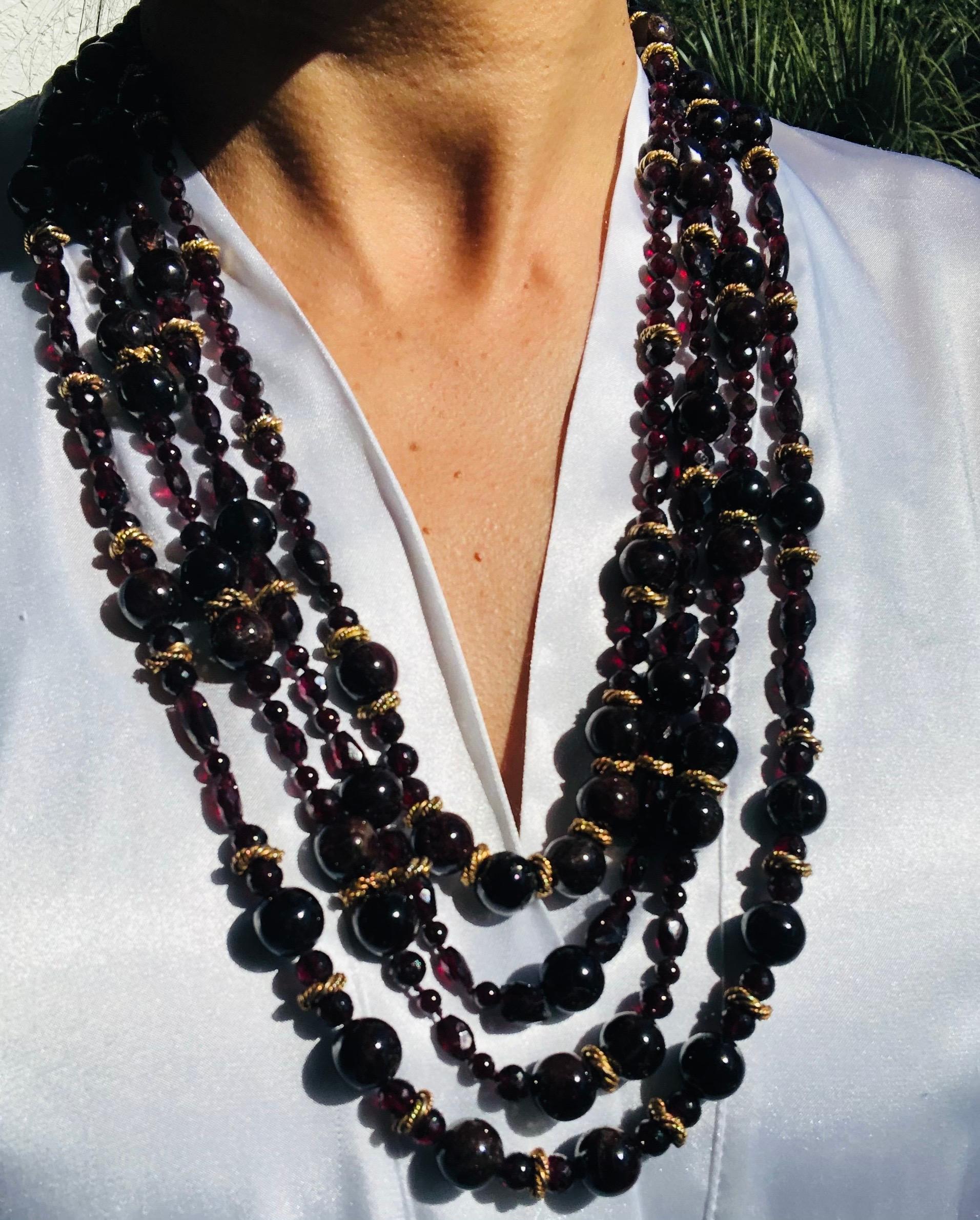 One--of-a-Kind

Garnets both polished and cut cascade in multiple strands, the longest is opera length, and the shortest matinee combines in a richness of garnets. Intersperse with twisted rope circles of vermeil, as well as a vermeil clasp.
The
