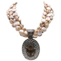 A.Jeschel 5 strand coin pearl necklace and Smokey Quartz necklace.