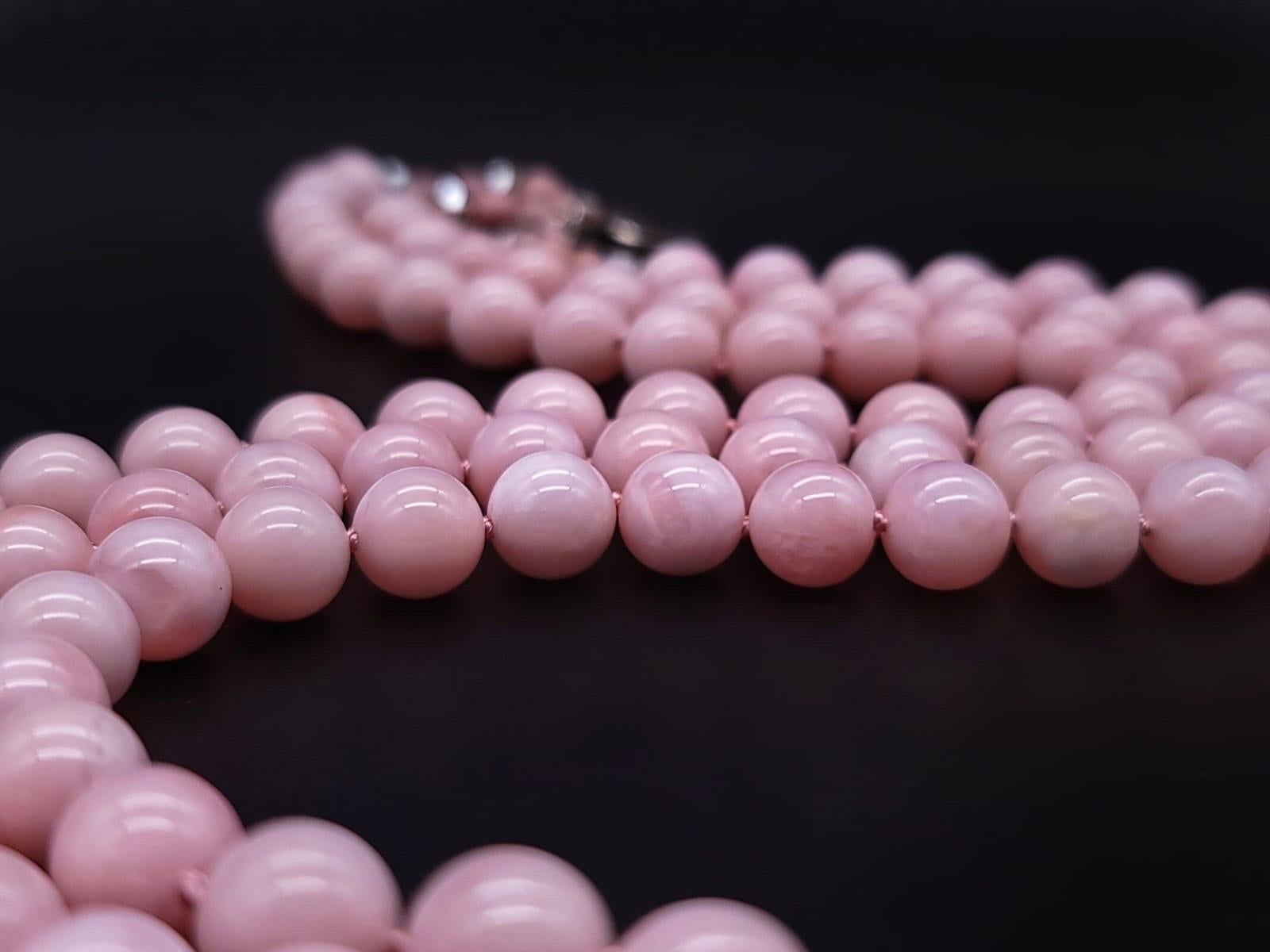 One-of-a-Kind

3 strands of matched 10 m.m beads, each strand just kissing the next are caught together with a signature closure of 6 m.m Pink Peruvian Opals,Pink Swarovski crystal and a clasp of Venetian glass set in sterling silver.

Pink Opal is