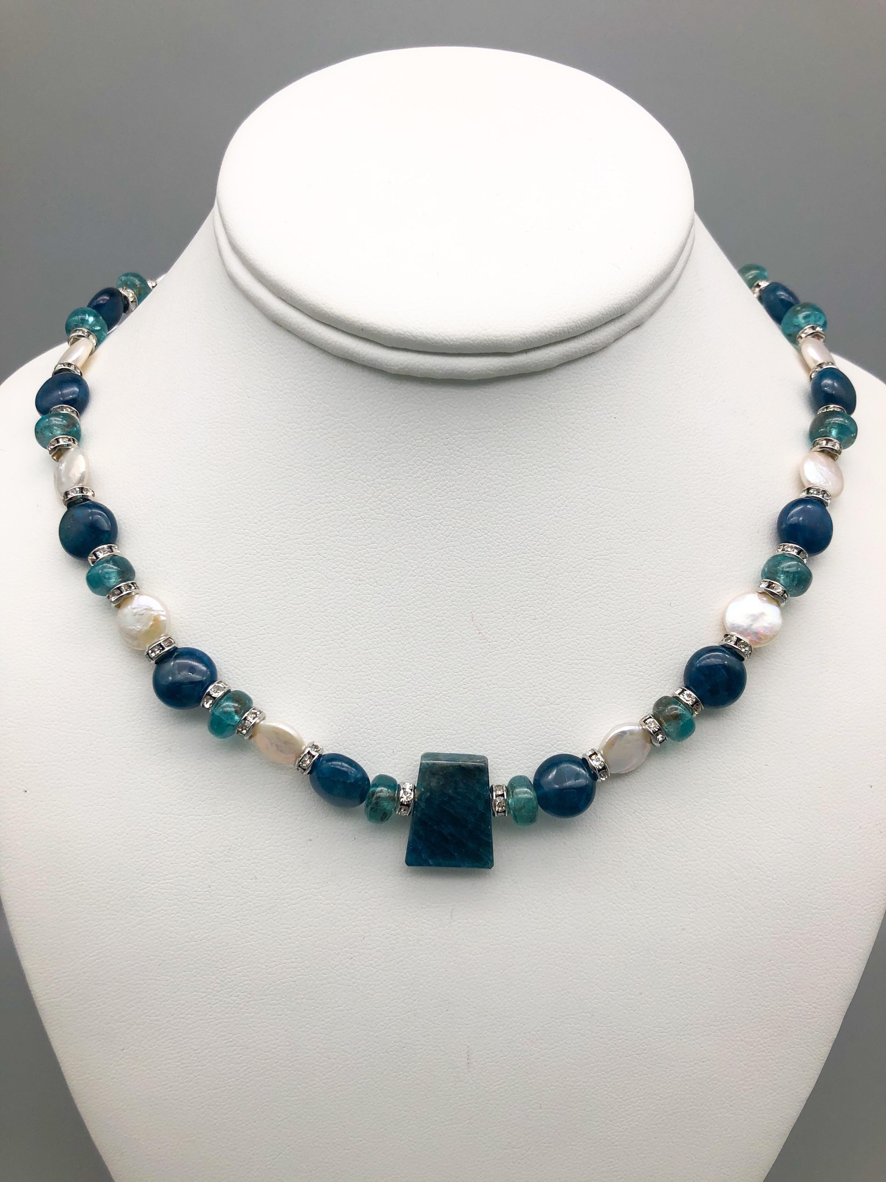 One-of-a-Kind

Sometimes simplest is best. Particularly when the stones are a mix of polished blue Apatite both translucent and opaque that blend and complement each other. The various Apatites are separated by small coin pearls as well as small