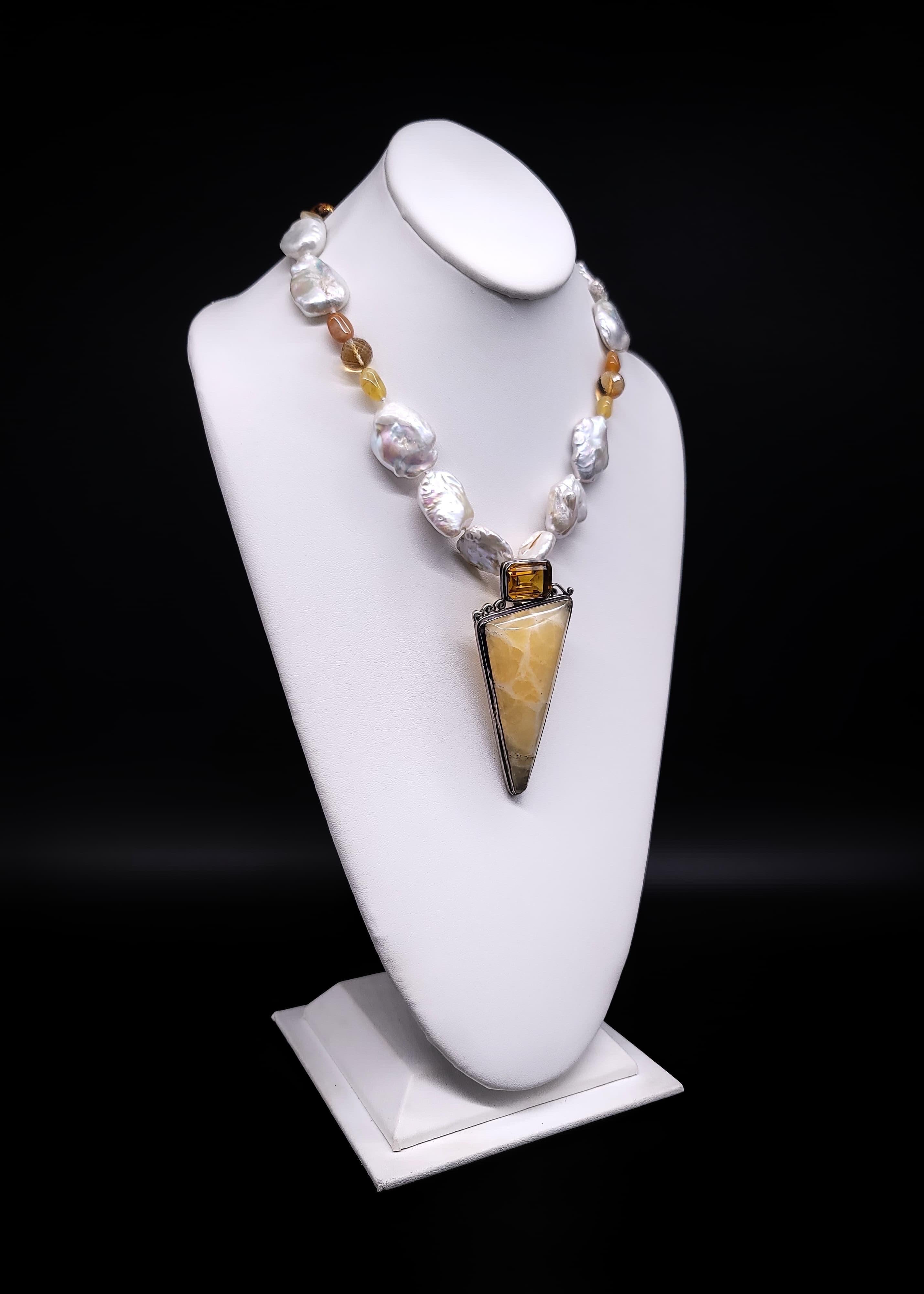 Captivate Hearts with Our Exquisite Stone Pendant Necklace!

Baroque Pearls and faceted Citrine gems intertwine in flawless harmony, complemented by delicate polished Yellow Onyx accents that exude both warmth and sophistication. In the spotlight is