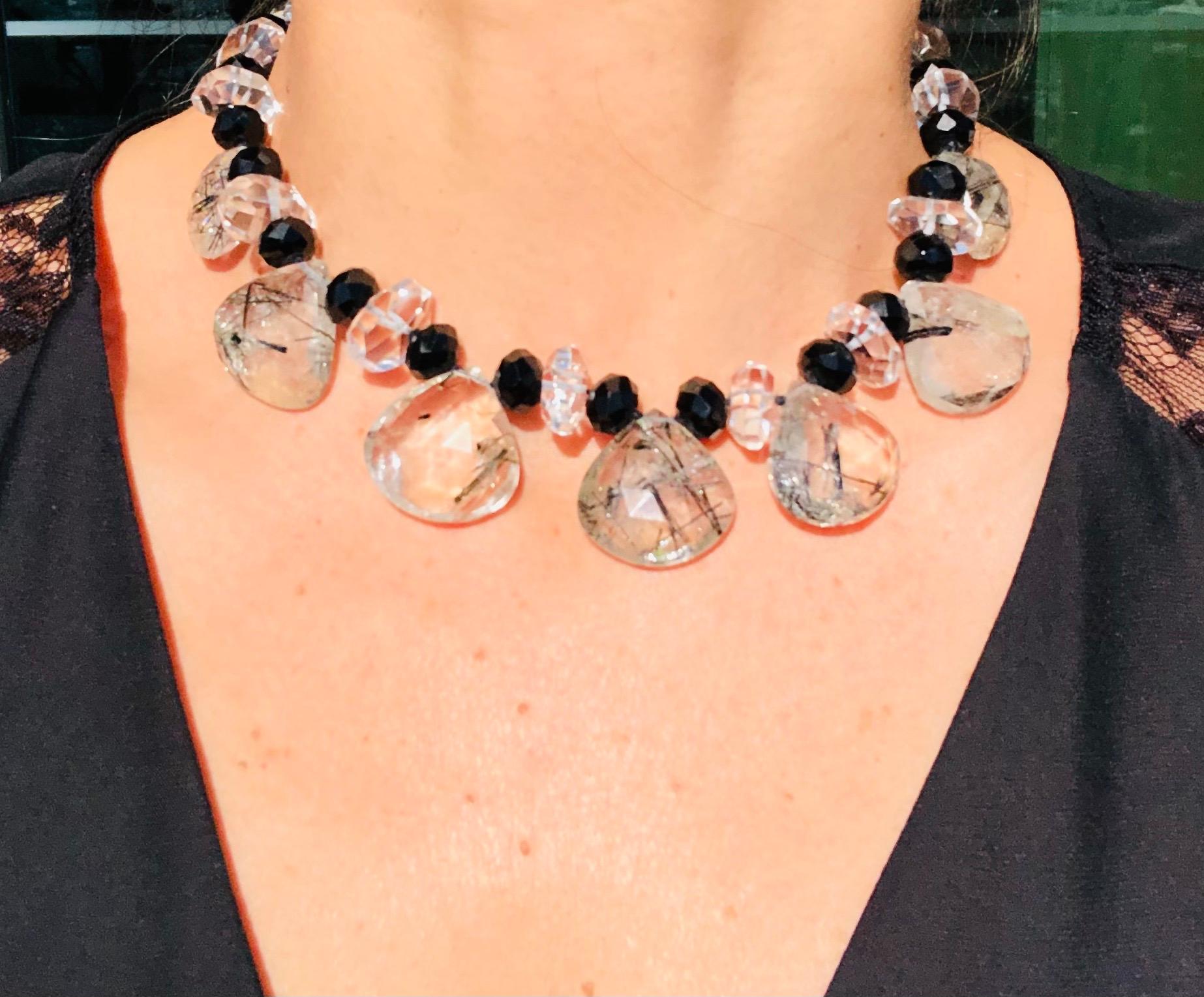 One-of-a-Kind
Black cut Onyx beads and teardrop rutilated Quartz team in perfect harmony.
Beautifully cut stones in a 16” choker. A necklace that fits perfectly inside a collar and doesn’t skip down and become invisible. Clasped with a Swarovski