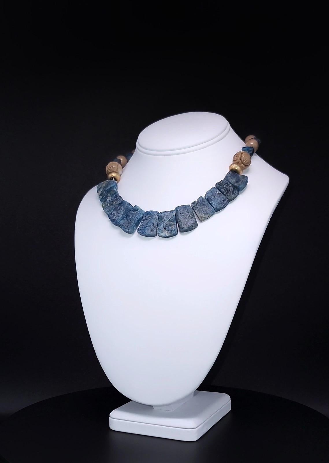 This exceptional, one-of-a-kind necklace is a true statement piece, featuring the captivating beauty of assorted Blue Apatite stones. The necklace combines both rough plates and hammered textures of Apatite, creating a unique visual contrast and a