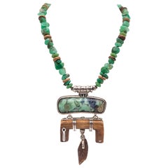 A.Jeschel Carved Fossil Pendant suspendend from a rich green Chrysoprase stones