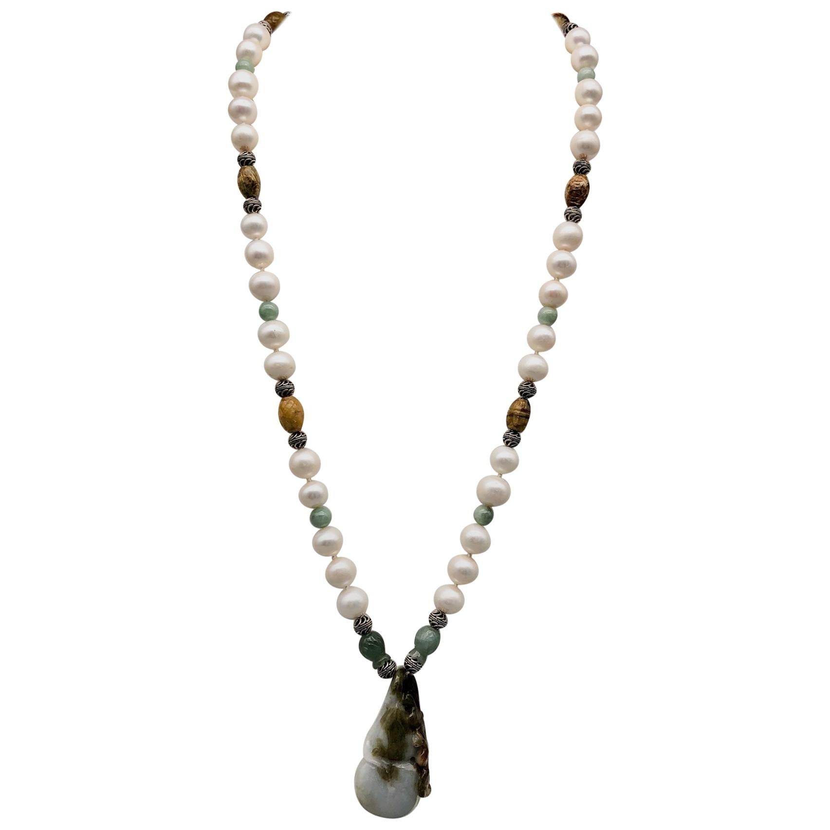 One-of-a-Kind
Step into a world of elegance and sophistication with this exquisite necklace, featuring a stunning carved peach blossom Jade pendant that anchors the piece with its unique beauty and intricate details. The pendant is just the