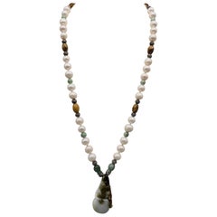 A.Jeschel Carved Jade and Freshwater Pearls make a Stunning Long Necklace.