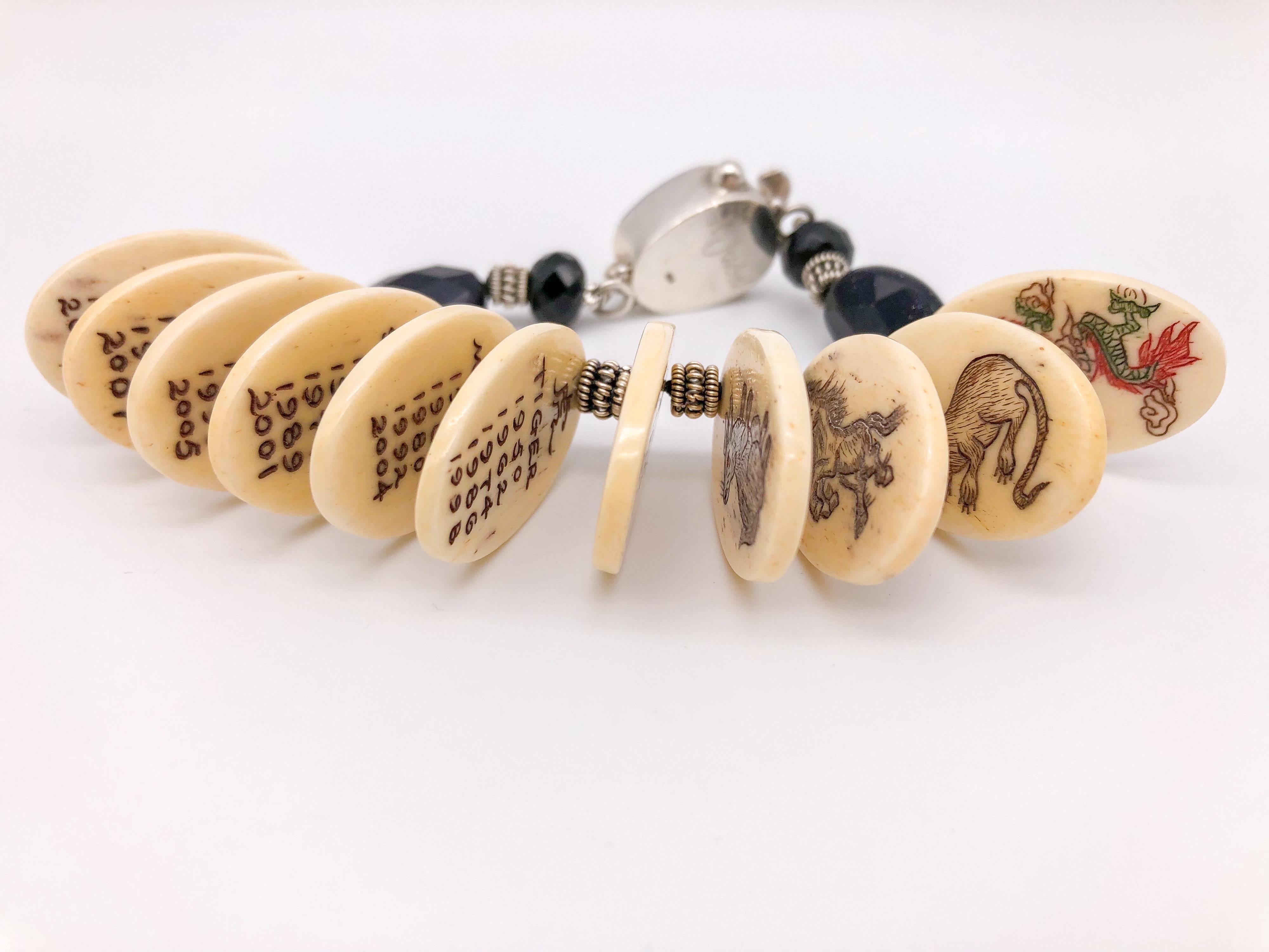 One-of-a-Kind
An incredible bracelet featuring 12 different animals representing the 12 Chinese Zodiac and year. Each oval bone is hand-painted, the handwork is very fine with incredible detailing, Sterling Silver spacers, and faceted Onyx beads