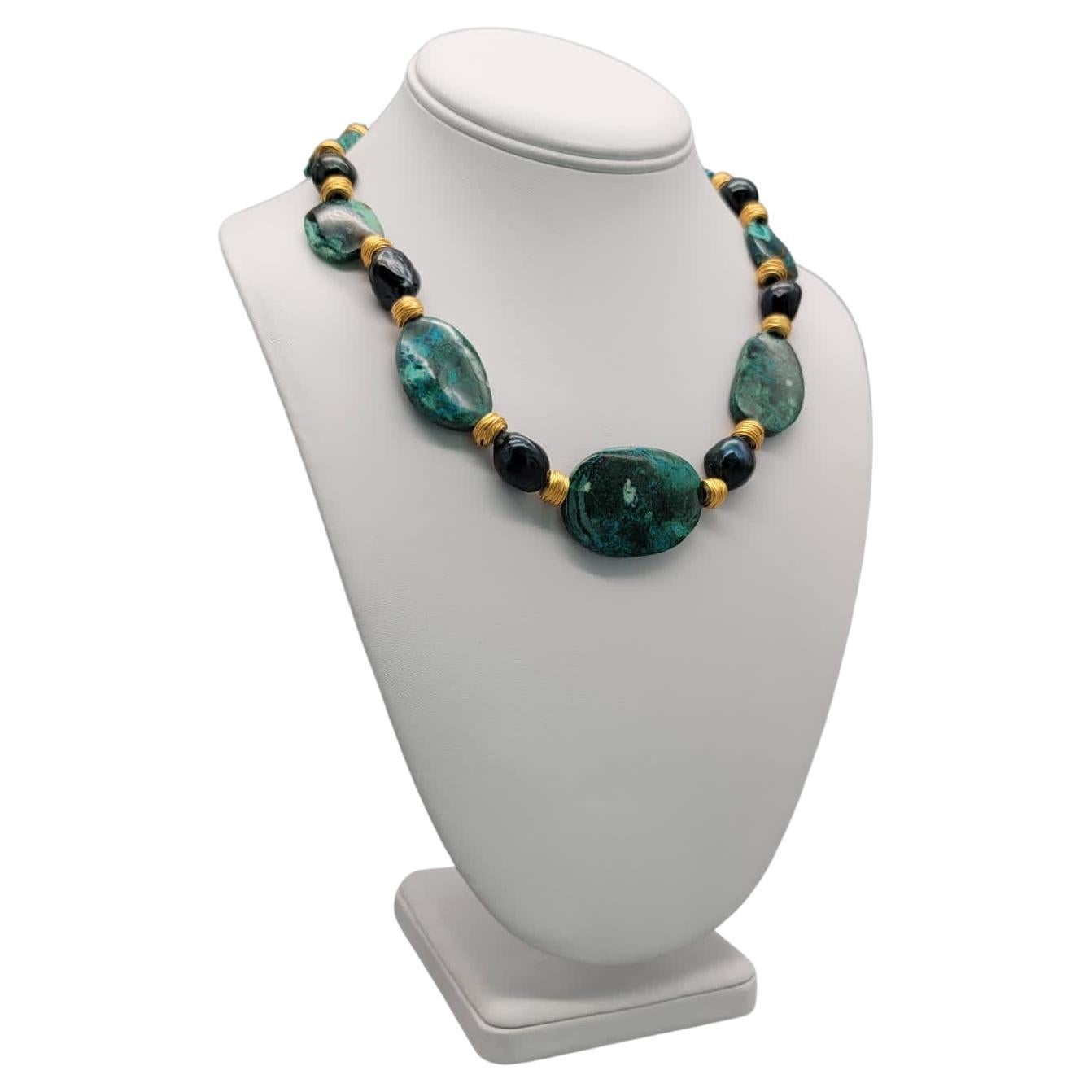 One-of-a-Kind

Gem Silica, also referred to as Chrysocolla Chalcedony, is considered the most sought-after chalcedony. The rich color (a mix of blue and green) is stunning and unforgettable. In this necklace, the gem silica plates are separated by