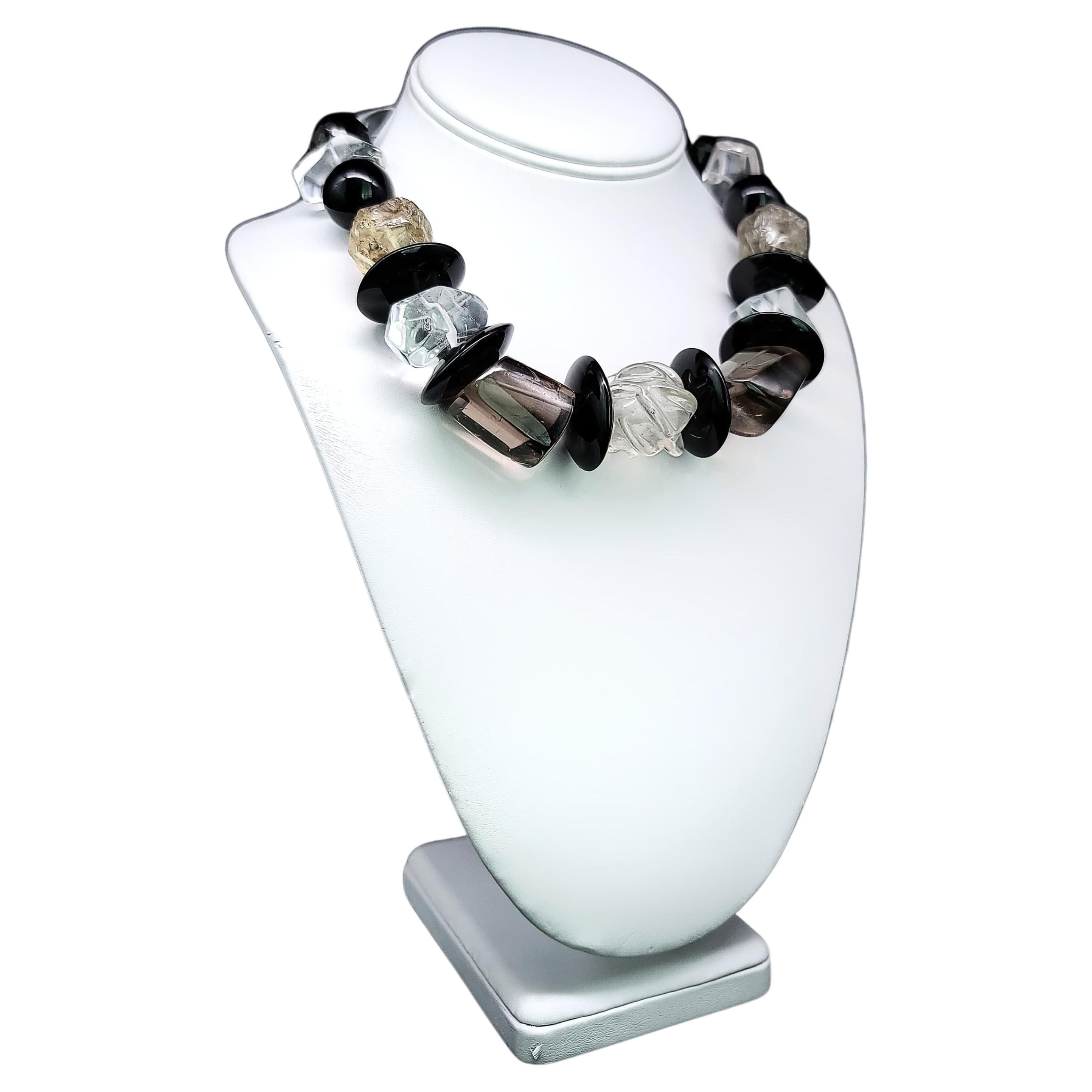 Exclusively Unique and Captivating Necklace:

This remarkable necklace is a one-of-a-kind creation that exudes both boldness and beauty in every facet. It showcases a striking combination of meticulously selected Crystal, Smoky Quartz, and Onyx