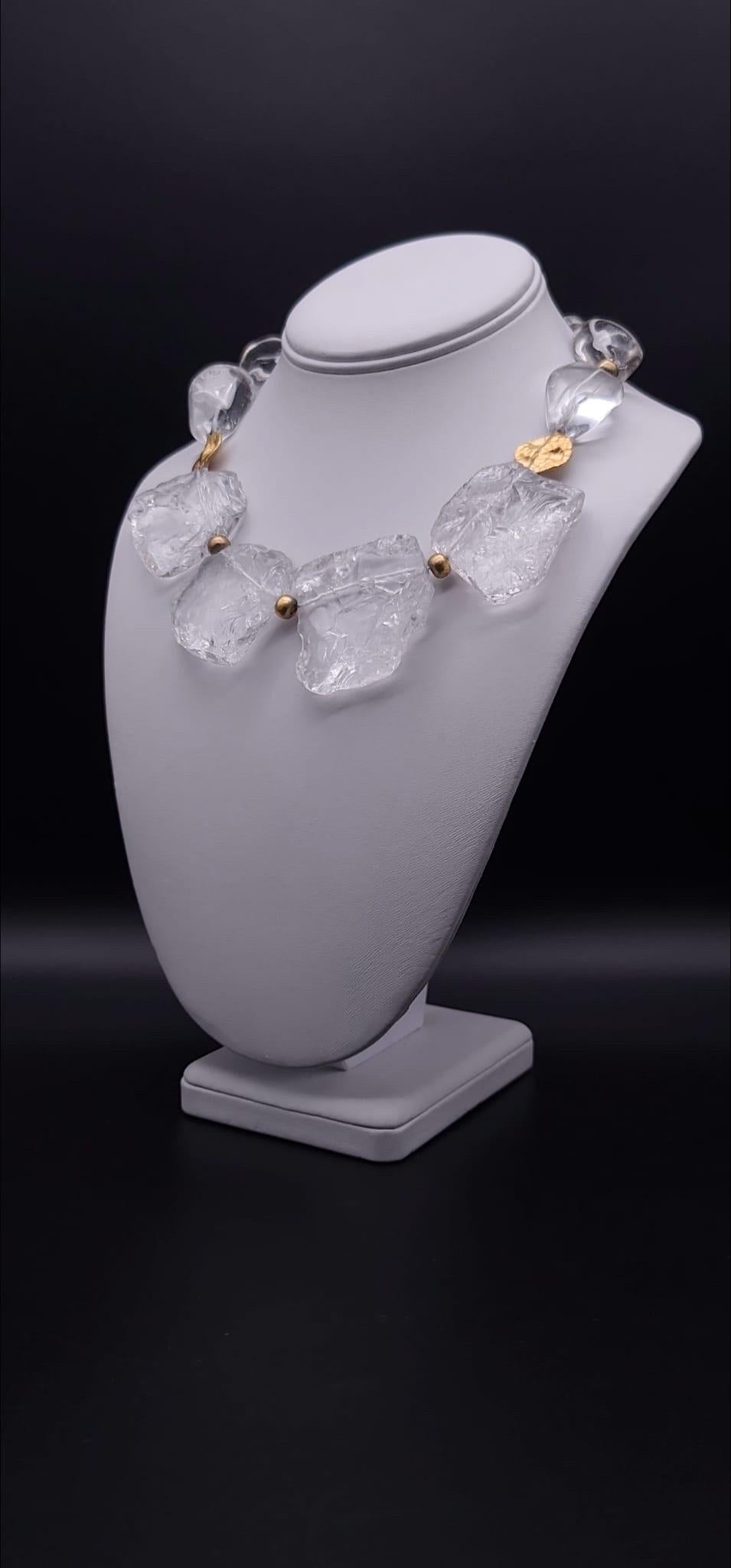 One-of-a-Kind

Fire and ice best describe this dramatic necklace of hammered rock crystal plates and clear polished Quartz beads. The icy look of the stones is accented by vermeil ( 22k over sterling silver) spacers as well as 2 hand-crafted