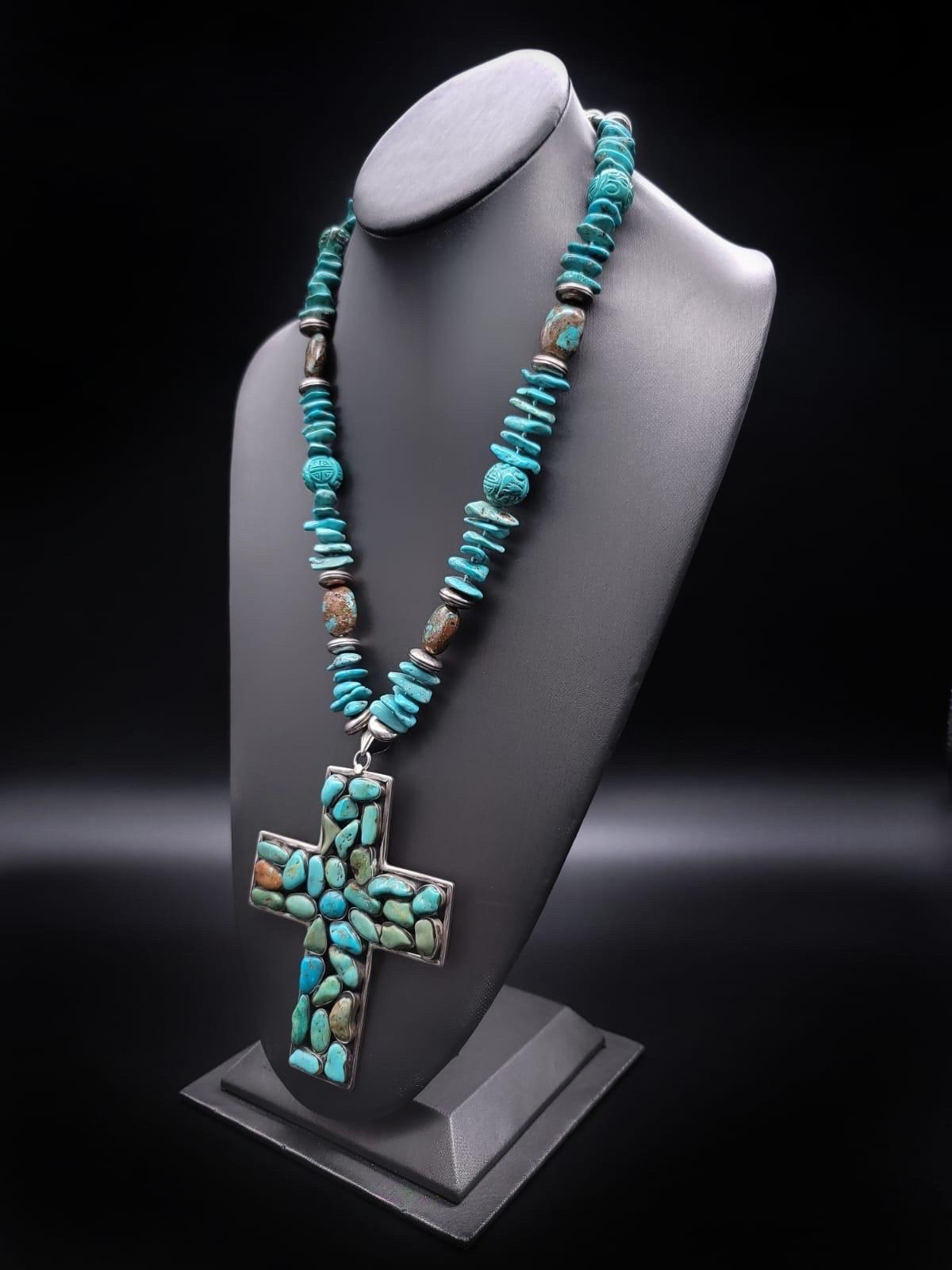 One-of-a-Kind

This exquisite long Turquoise necklace boasts a large 4''x3'' silver and Turquoise cross pendant made in Mexico. The pendant features approximately 27 mixed turquoise polished beads, each individually set in silver. The necklace