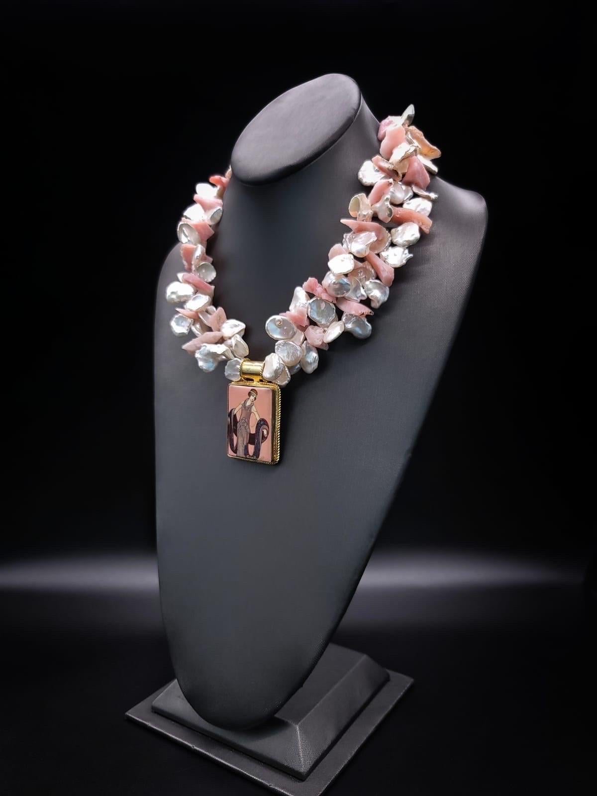 

Introducing our One-of-a-Kind Exquisite Necklace, A harmonious fusion of elegance and craftsmanship. This remarkable necklace boasts two strands of radiant Keshi Pearls with Pink Peruvian Opals, culminating in a masterpiece adorned with a unique