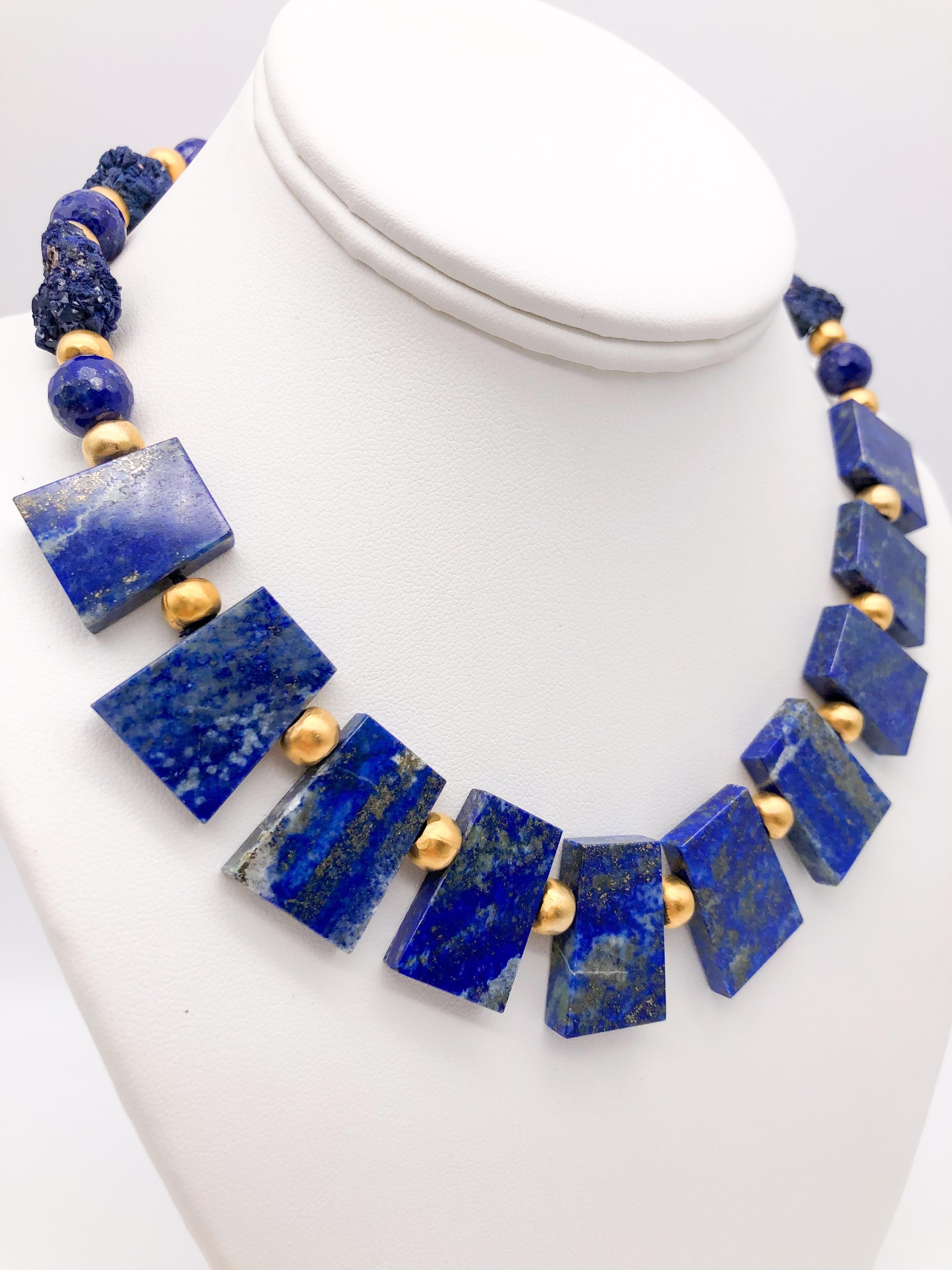 One-of-a-Kind

A collar of fine blue polished Lapis Lazuli shot through with gold is suspended from a strand of hammered azurite and Lapis beads, the clasp is a polished Lapis vermeil box, mankind. Cleopatra was one of the earliest collectors of