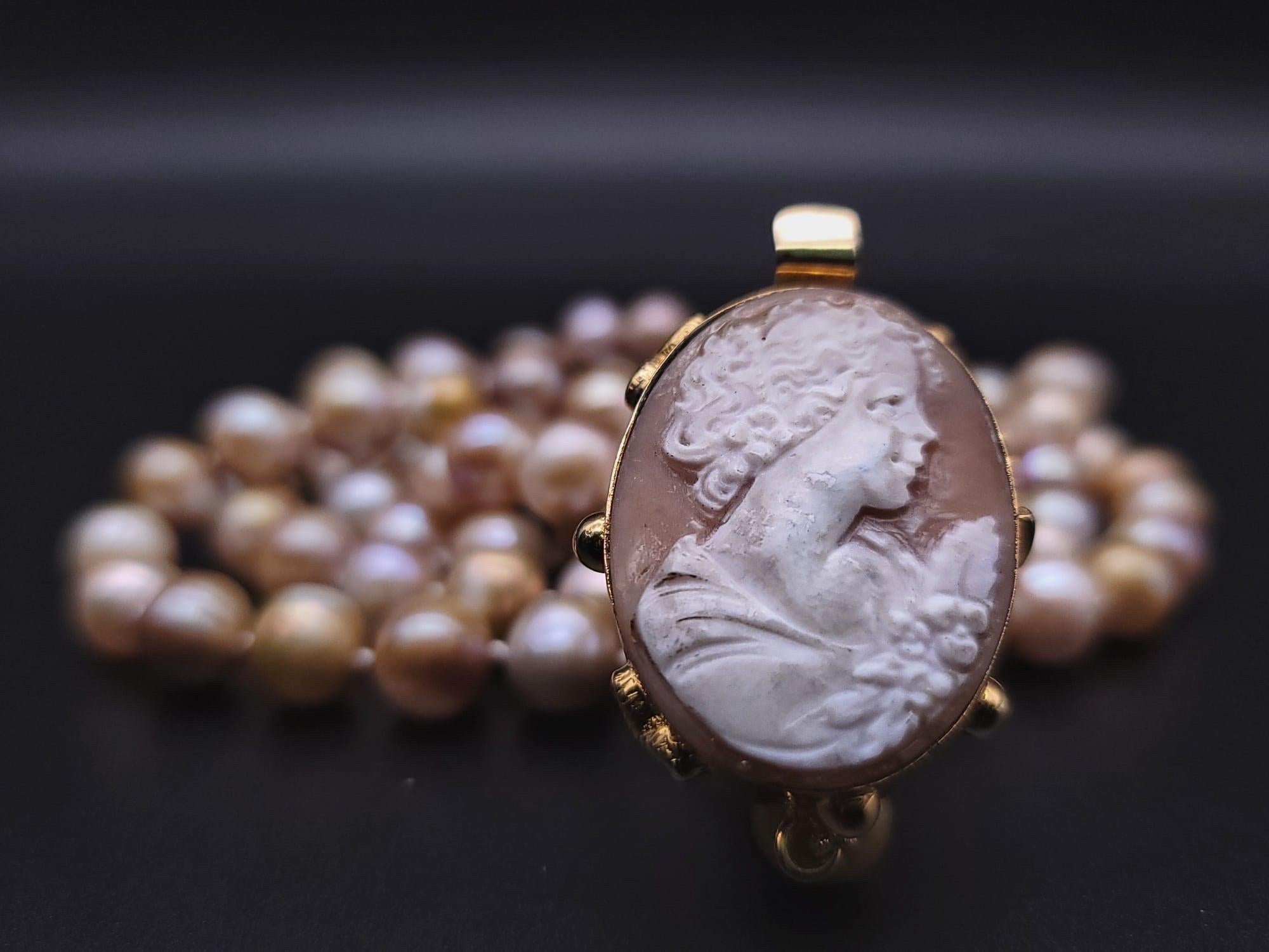 One-of-a-Kind

Fantastic 48” rope of 10m.m Champagne Pearls. Wear it long or wrap it into a 2 strand necklace. After all, there is plenty of length for a conventional two strand. Either way the delicate, finely carved vintage Italian cameo clasp set