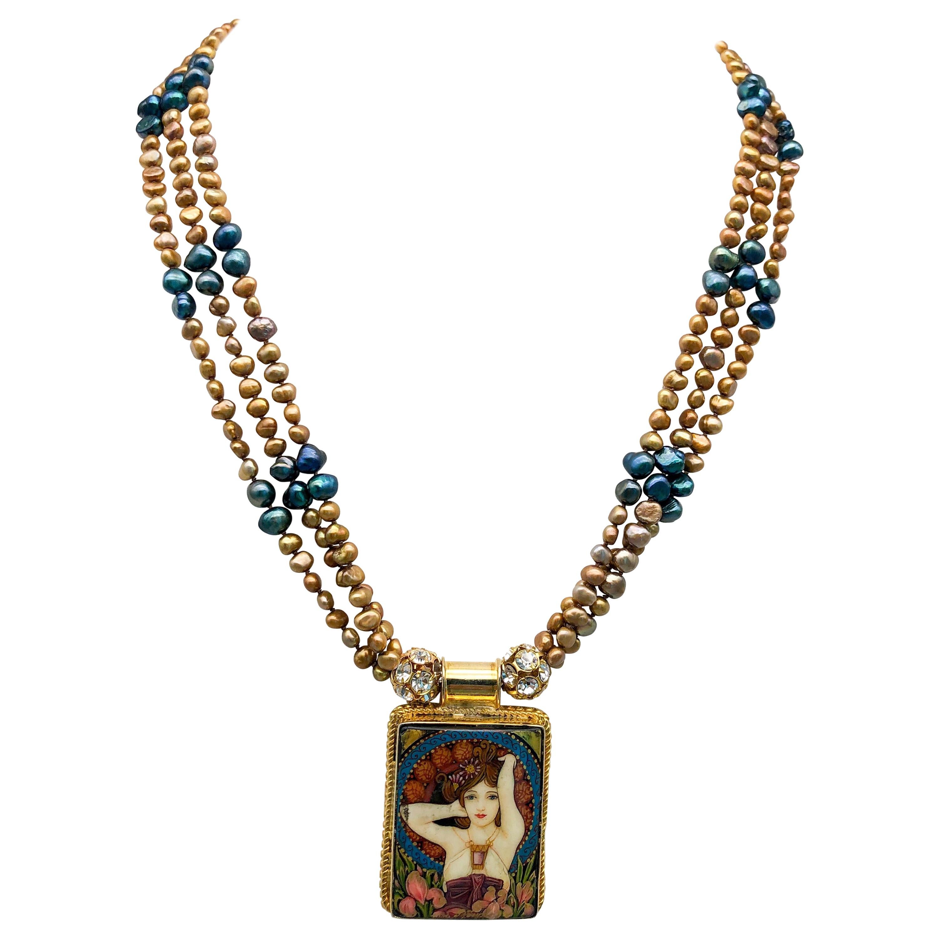 One-of-a-Kind
This exquisite pendant necklace is a true masterpiece in the style of the renowned artist Gustav Klimt. The pendant boasts intricate detailing and a rich color palette, measuring an impressive 2 1/2 x 2