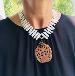 A.Jeschel Flattened fresh water pearl with carved jade pendant