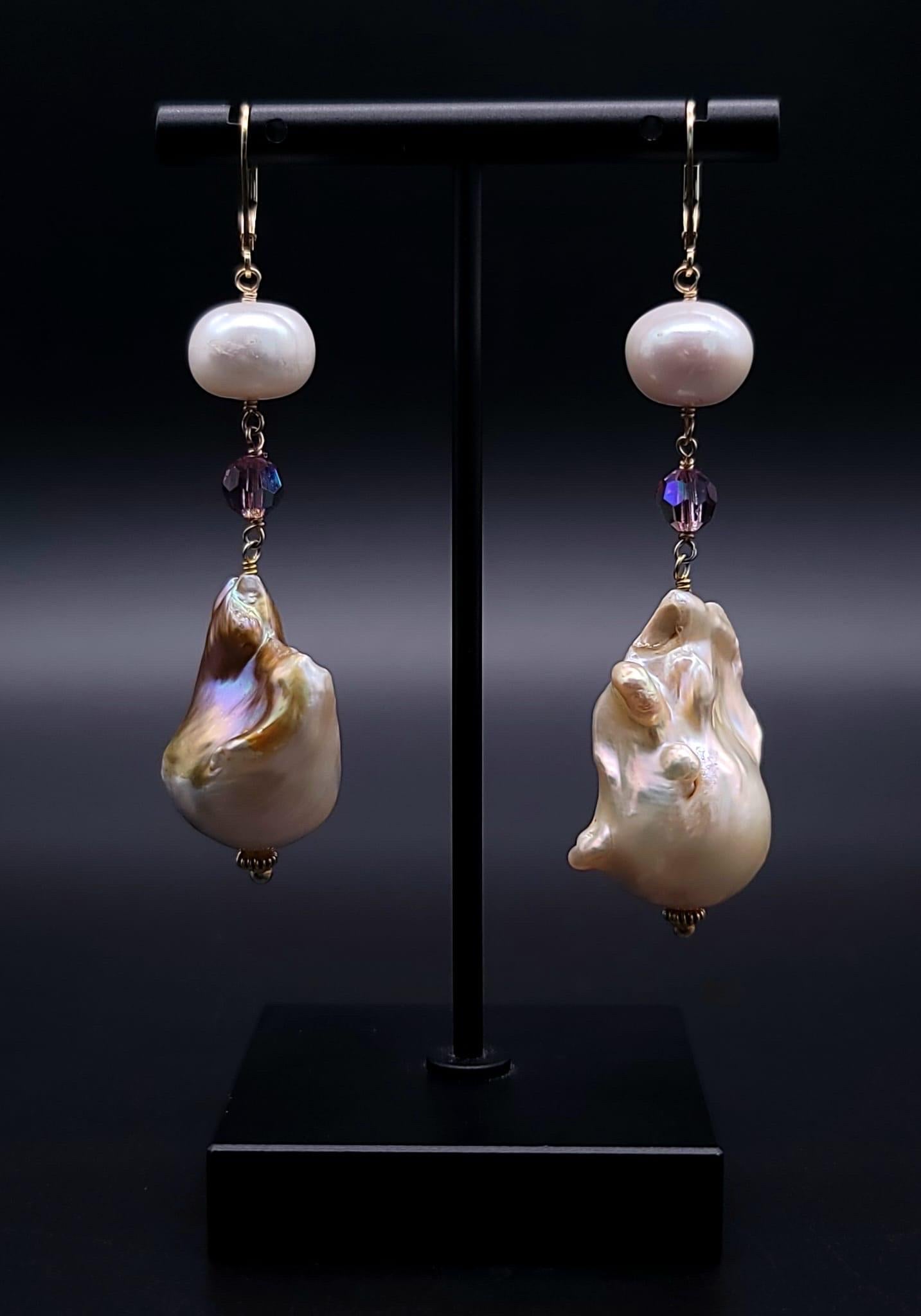 One-of-a-Kind

Introducing a pair of exquisite baroque pearl earrings adorned with Swarovski crystal - a captivating combination that fuses the allure of organic beauty with the brilliance of precision-cut gemstones.

Each earring features a