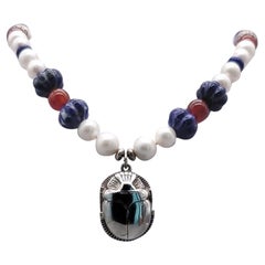 A.Jeschel  Freshwater Pearl and Lapis necklace with a silver scarab pendant.