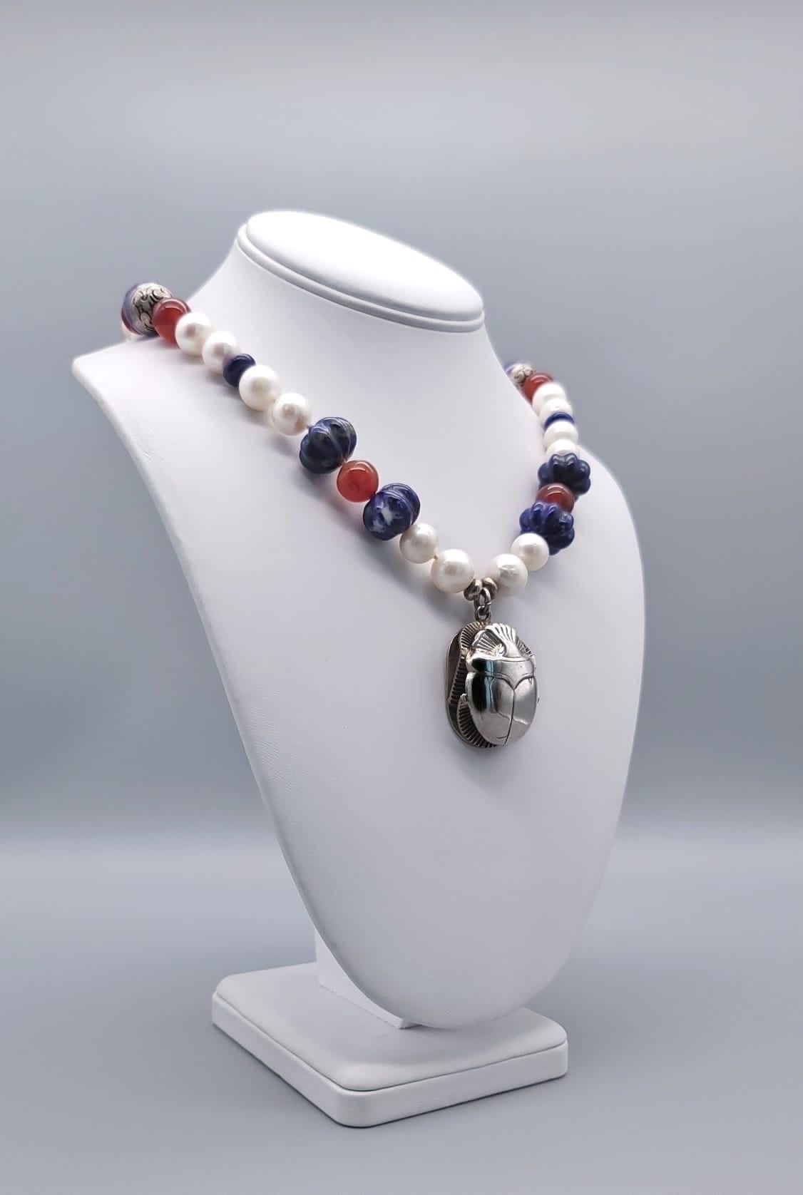 Mixed Cut A.Jeschel  Freshwater Pearl and Lapis necklace with a silver scarab pendant. For Sale