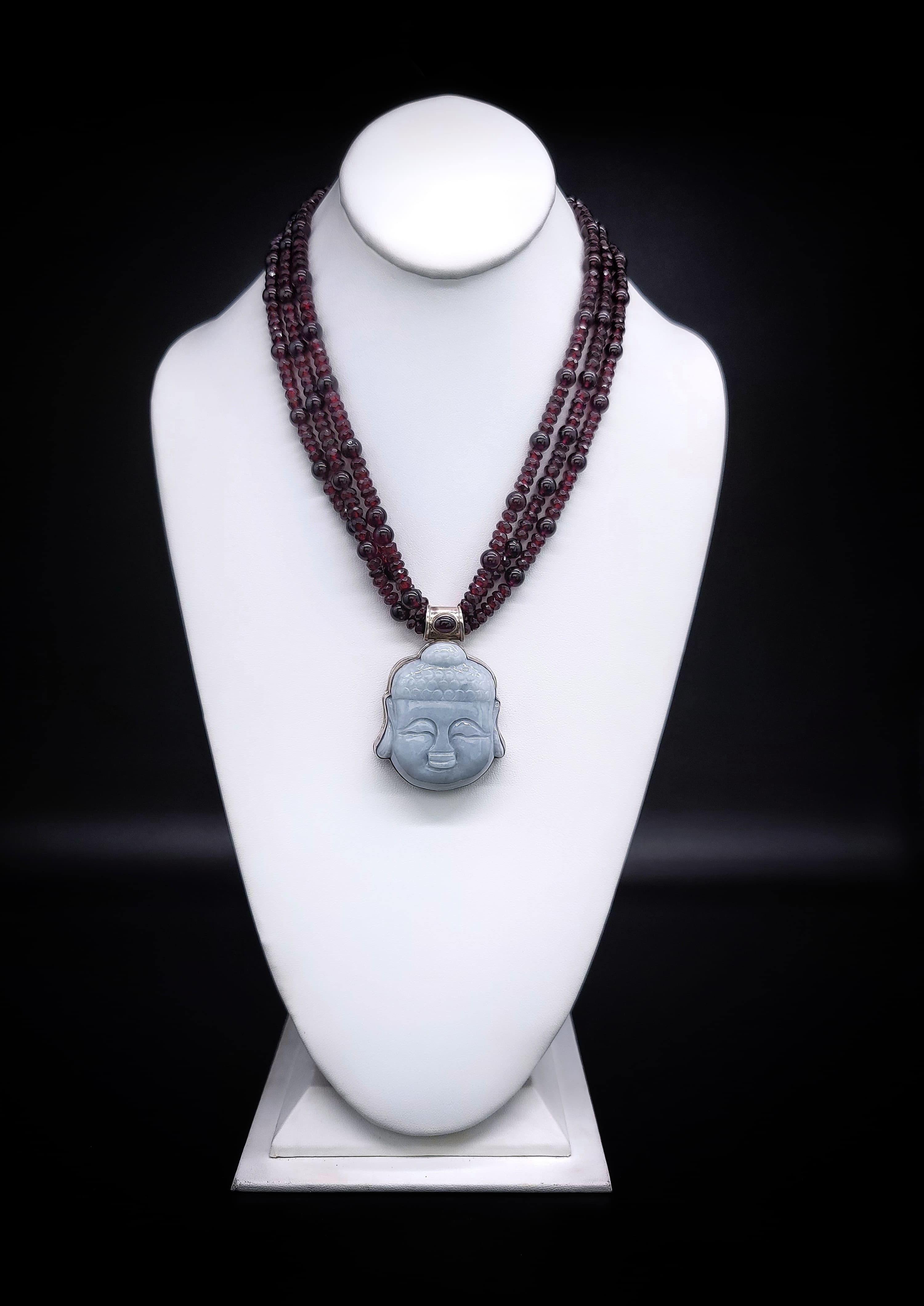 Radiant Rarity

Prepare to be captivated by a true work of art – a one-of-a-kind masterpiece that encapsulates the essence of opulence and spirituality. This exquisite necklace features three strands of lustrous hand-knotted Garnet gemstone beads,