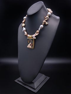 A.Jeschel Glamorous Baroque Pearl with an Art Deco miniature pendant.