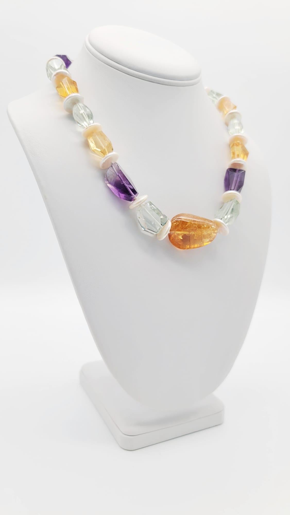 One-of-a-Kind

An amazing necklace combining a variety of colored Quartz in a melange of cuts to make an interesting flattering necklace, the center stone is a polished Citrine. Surrounded by hexagonally cut and polished Green and Purple Amethysts,
