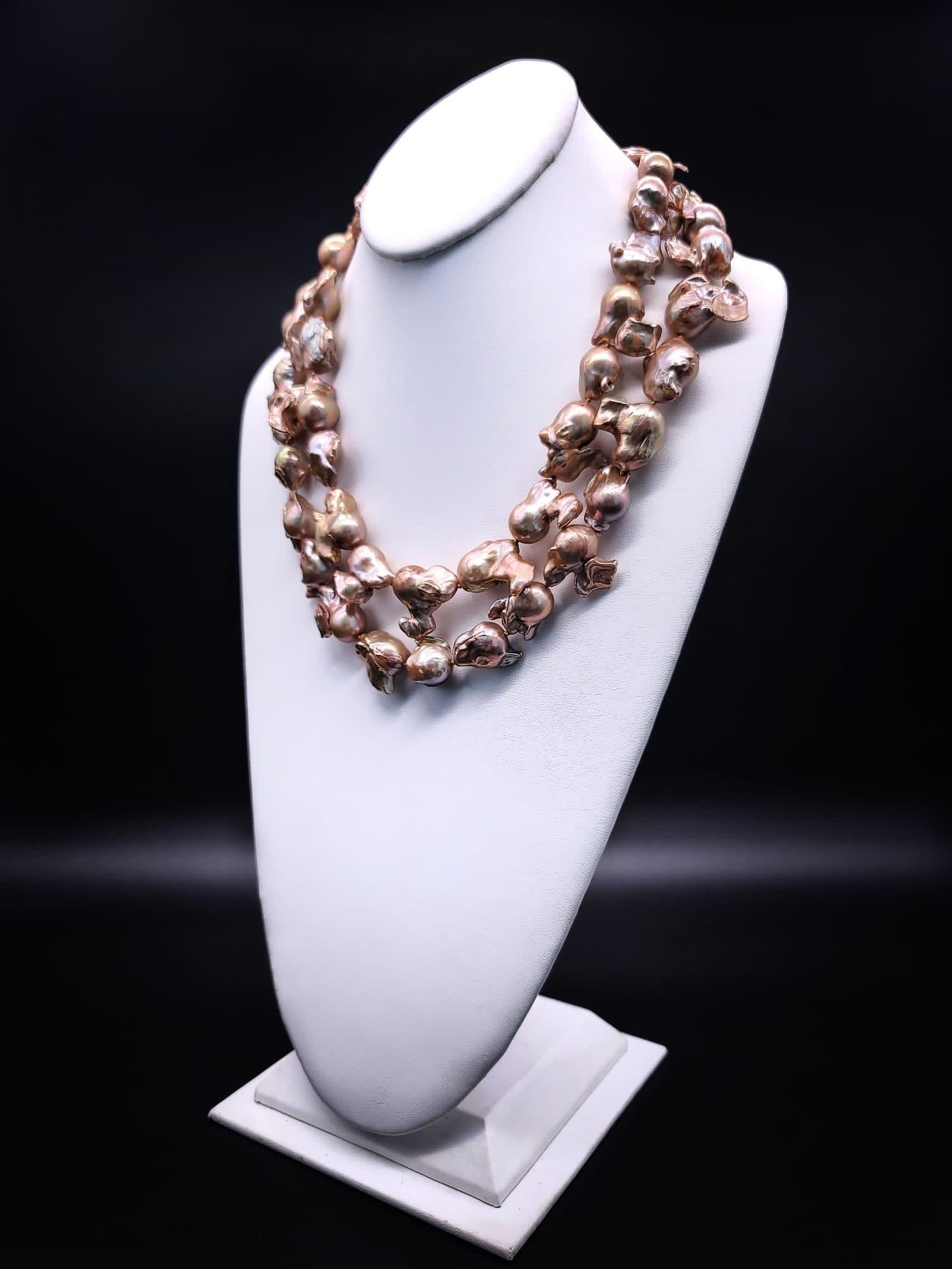 Mixed Cut A.Jeschel Gold Baroque Pearl Necklace with a signature clasp.