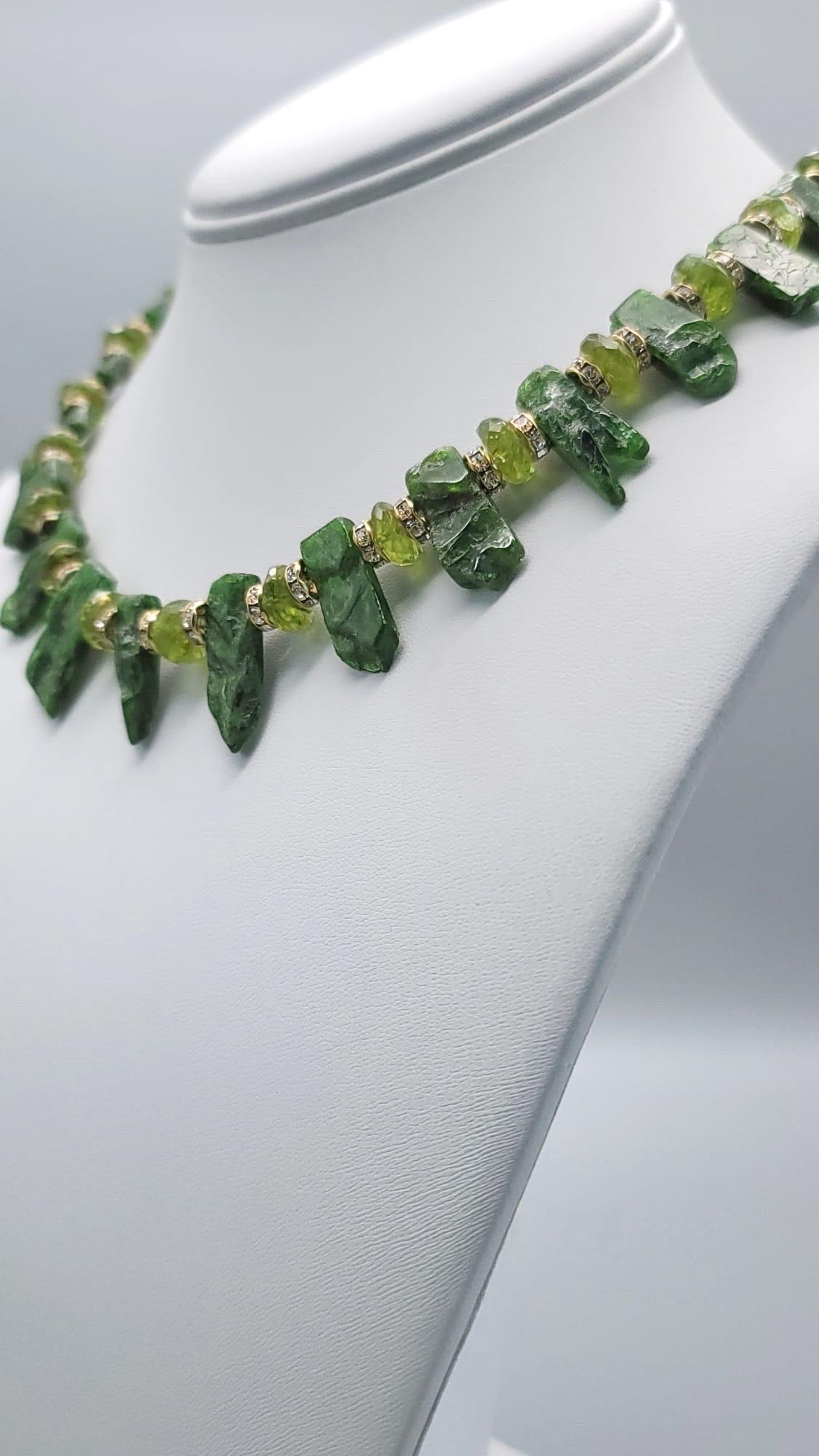 One-of-a-Kind

Gorgeous green Chrome Diopside paired with Peridot, a tone lighter, makes a striking statement. The Chrome Diopside is cut very cleverly to appear rough on the front  side and smooth on the underside ,as well as thin jagged finish on