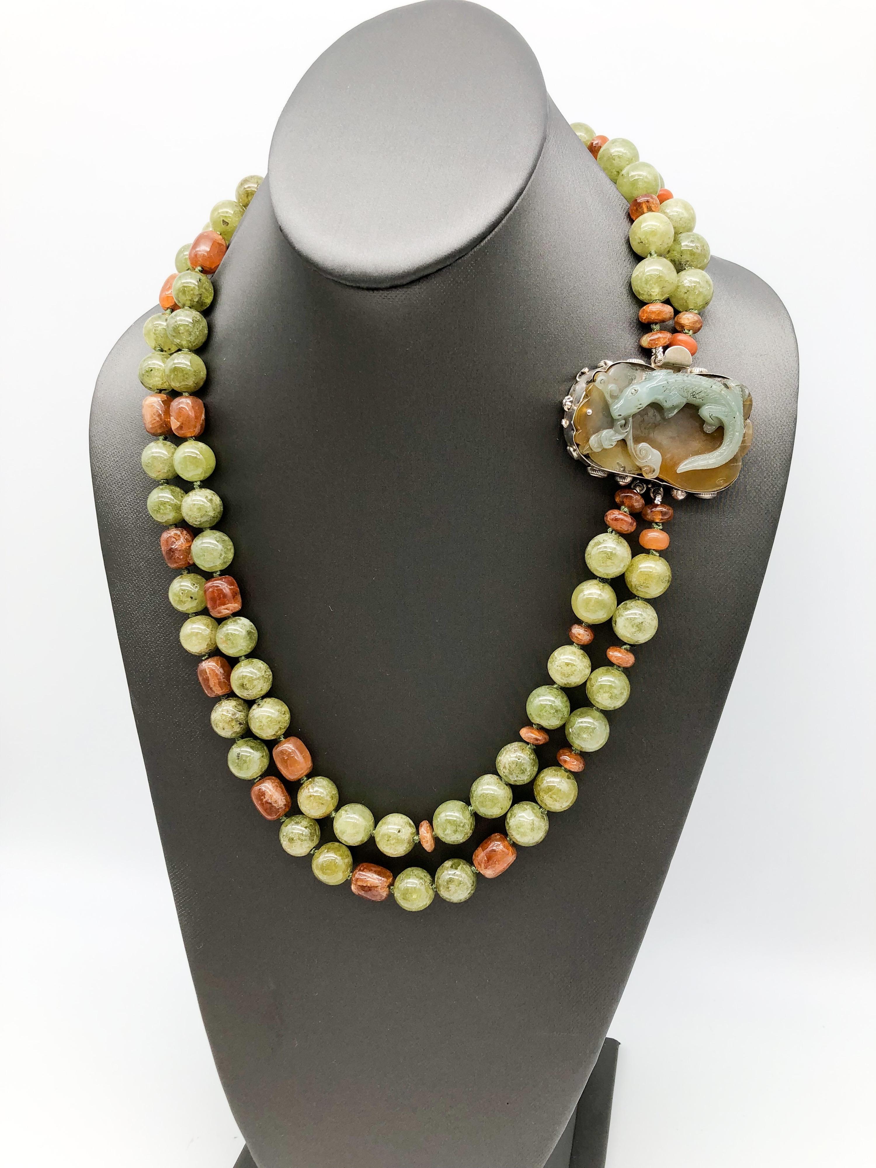 One-of-a-Kind
Double strand green Garnet necklace supports a carved Jade crocodile clasp in the same color tones.
Not all garnet is the well-known burgundy color.In fact, green garnet, known as Grossular, is rarer than the red stone and particularly