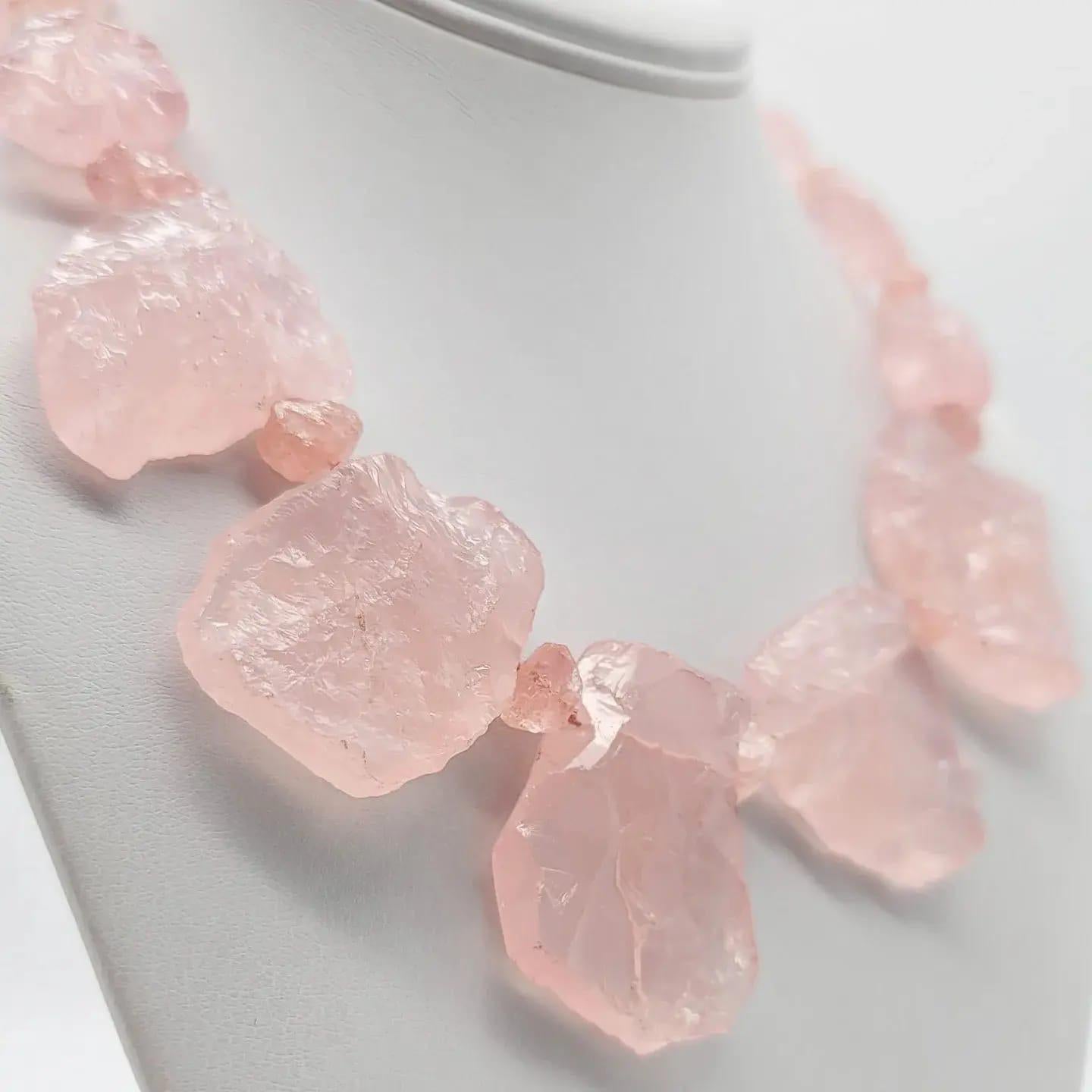 One-of-a-Kind

Who would believe a Rose Quartz necklace could be so powerful.? But here you have it. Large well colored plates of polished and hammered stones balanced and carefully matched to make a really “ pretty in a pink statement.  The clasp
