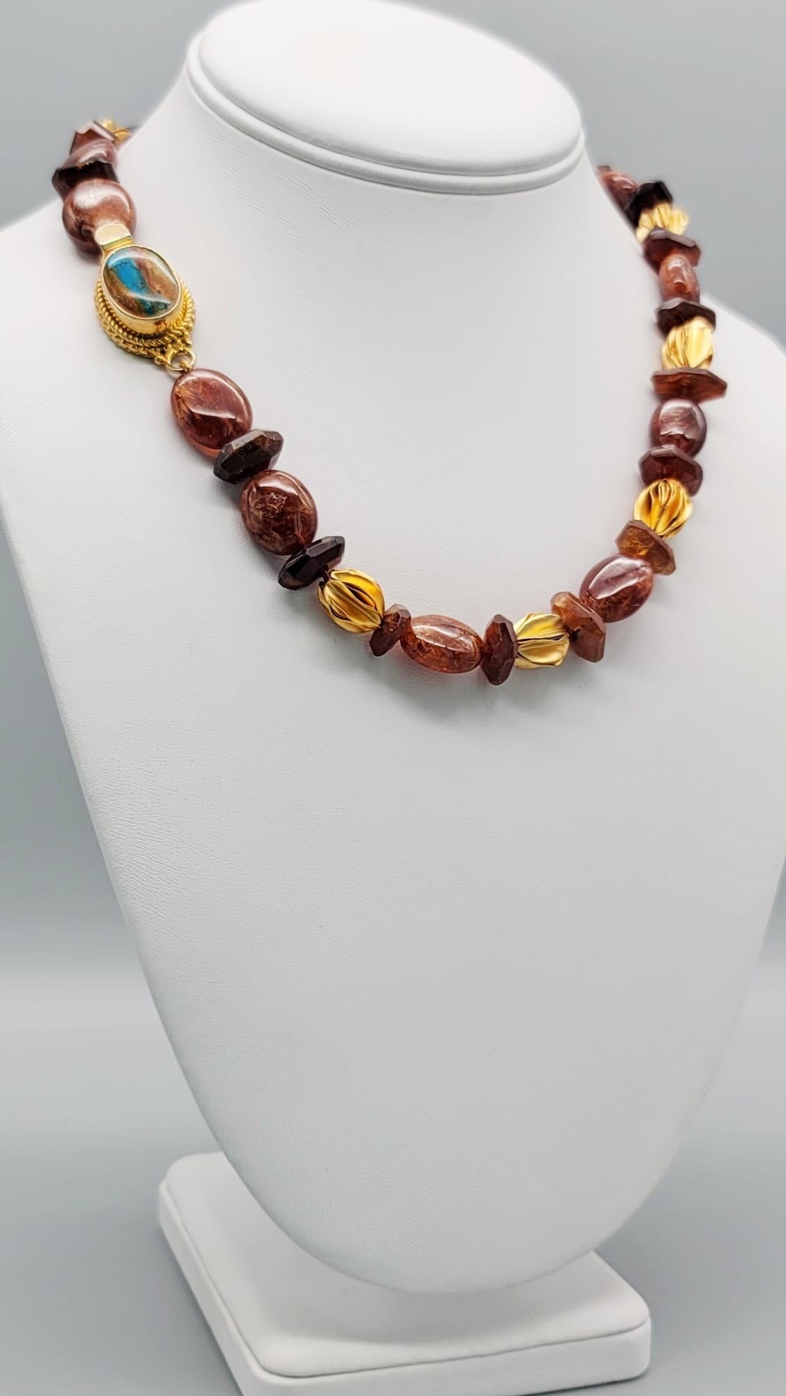 One-of-a-Kind

Hessonite Garnet set in a classic single strand necklace . The unusually rich reddish-brown coloring of the polished beads, mixed with the sharpness of the more deeply colored roundels blend extremely well with the unusual vermeil