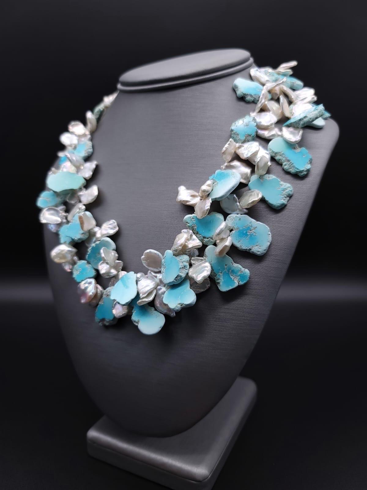 One-of-a-Kind

The necklace resembles the foam of ocean waves lapping the coastline of a Dominican beach. The Larimar, which by the way is only mined in the Dominican Republic, is cleverly cut so that the flat sides are Polished and the edges are