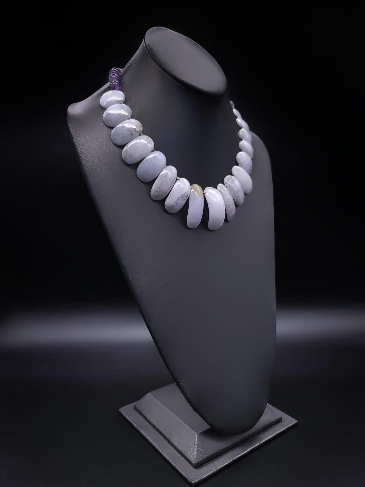 One-of-a-Kind


“The stone of the Angels”…  Lavender Jade imported to China from Burma (Myanmar) in the early 1800”s and highly desirable once introduced is the centerpiece of this lovely softly colored necklace containing 3 different desirable