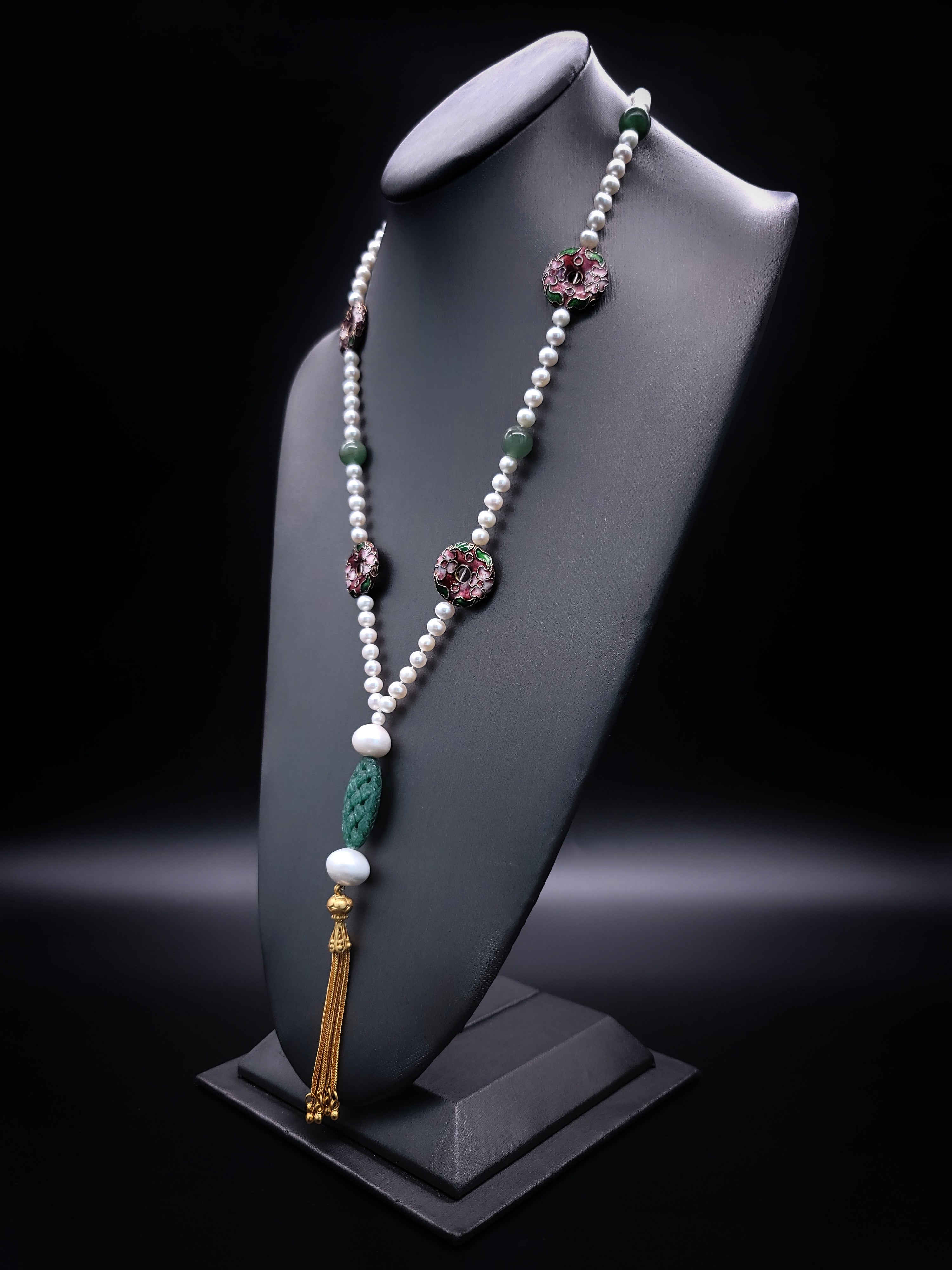 One-of-a-Kind

A colorful 34 “inch necklace. Jade, richly colored Chinese cloisonné, 6mm pearls, mix to make a charming, go with anything, long strand. The  Vermeil tassel assemblage of carved green aventurine and  14mm pearl anchor the necklace.