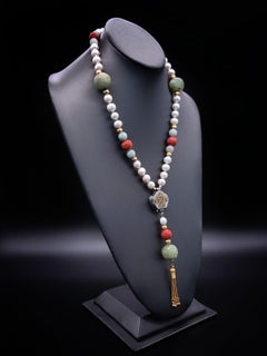 A.Jeschel Long Pearl necklace with Jade carved beads.