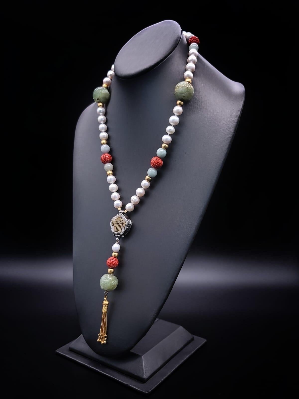 Contemporary A.Jeschel Long Pearl necklace with Jade carved beads. For Sale