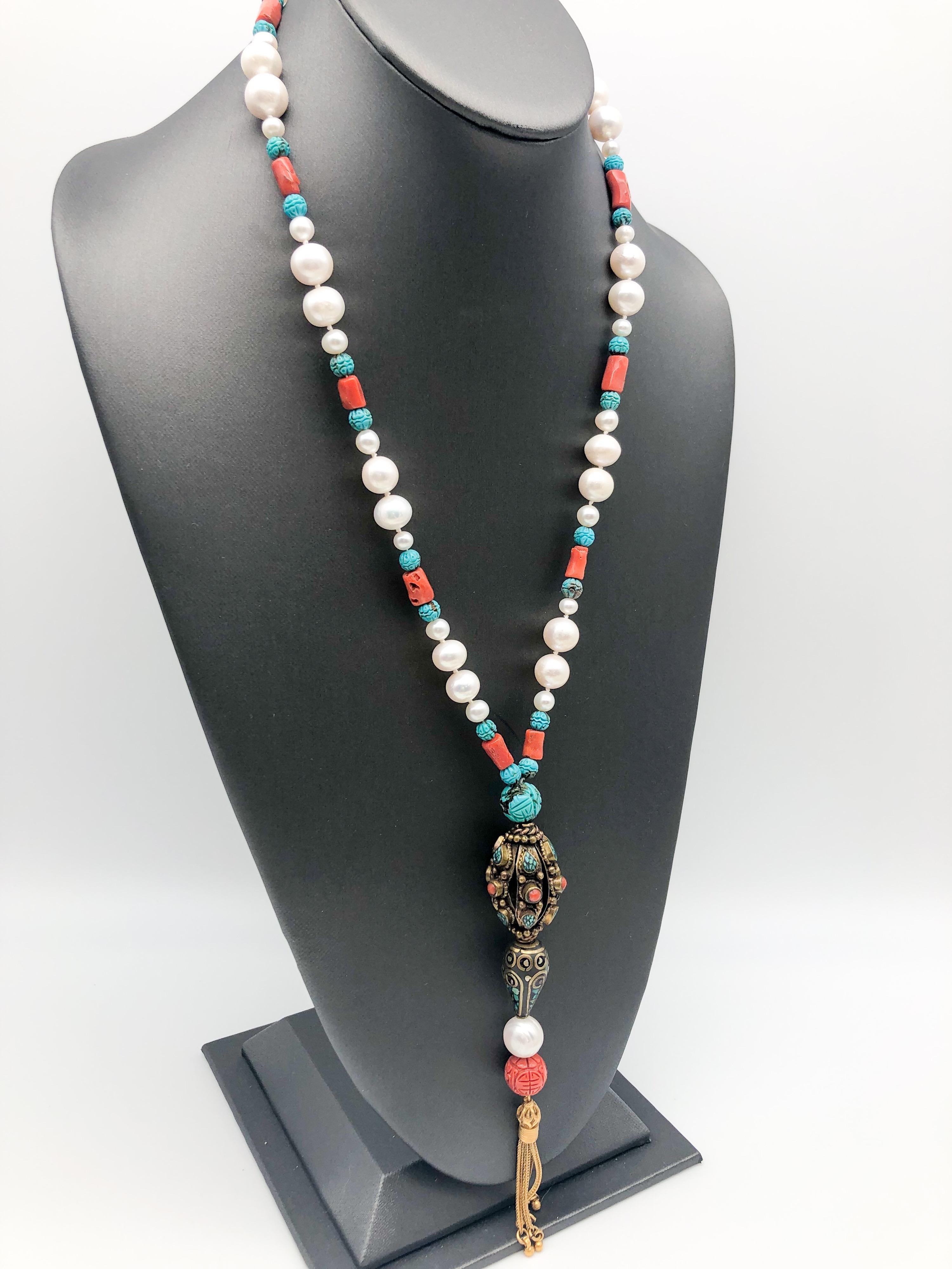 One-of-a-Kind

Introducing a long necklace that exudes timeless elegance and sophistication, reminiscent of the iconic Coco Chanel. This stunning piece is anchored by an assemblage of interesting stones, including two unusual vintage Tibetan beads,