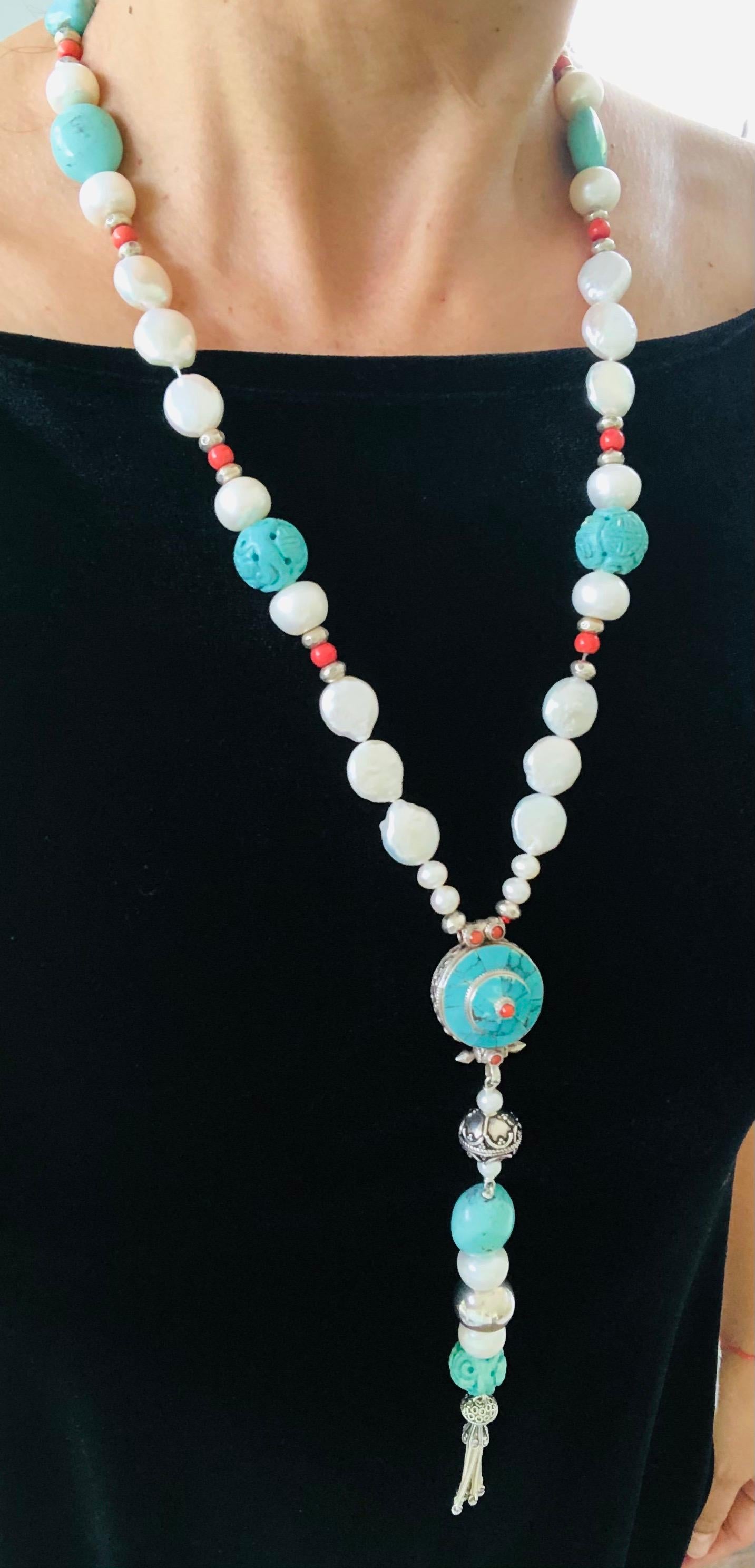 One-of-a-Kind
An unusual assortment of interesting elements centered by an authentic Ghau Box handcrafted in a Tibetan monastery inlaid with Turquoise and silver filigree, Chinese carved turquoise, polished American turquoise, freshwater coin