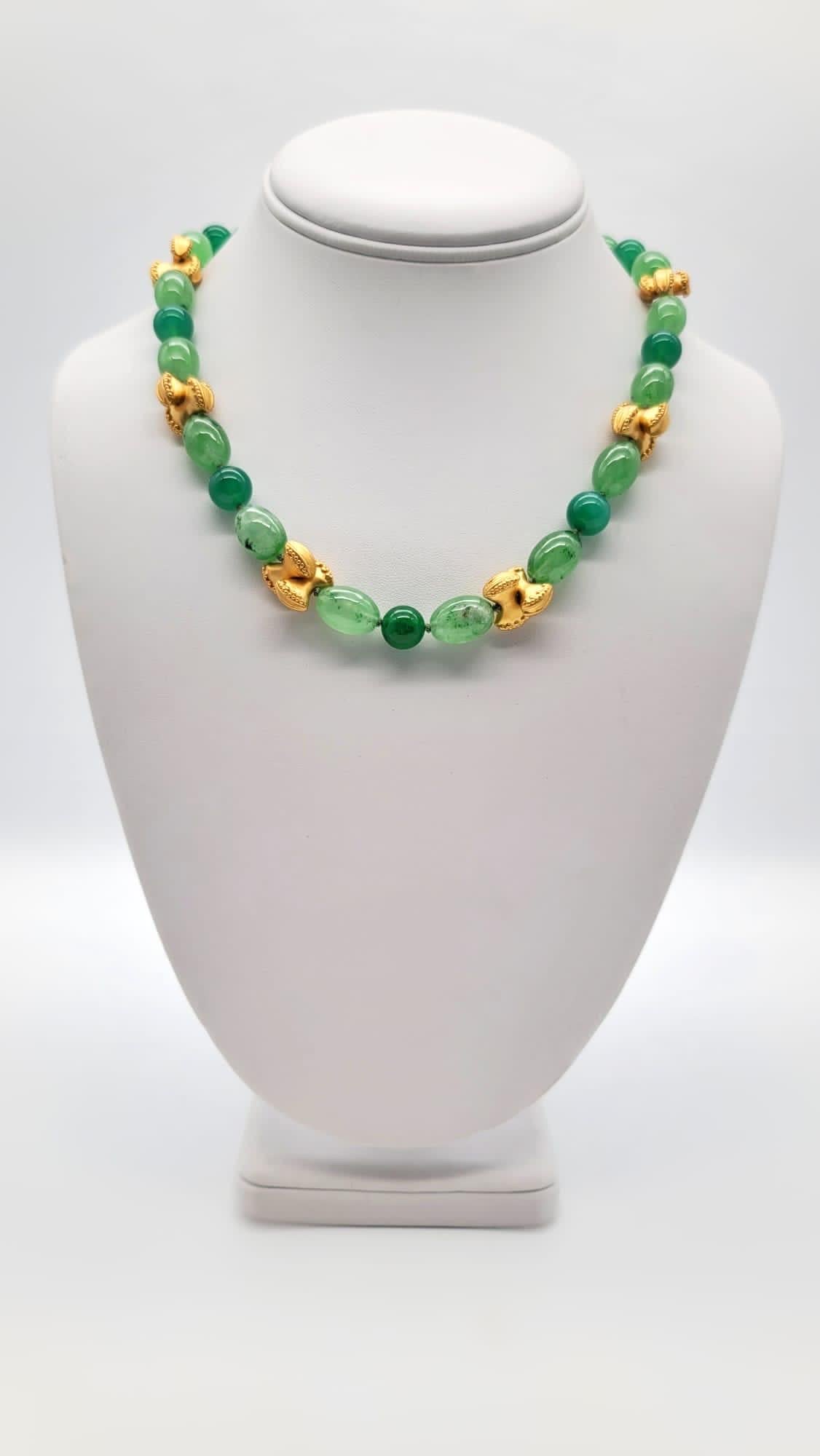 One-of-a-Kind

Lucky Jade in two shapes and shades to double the charm.
Bright green highly sought after 8m.m Apple jade round beads and paler green translucent oval beads. The necklace is accented with elegant vermeil bow ties and an elegant