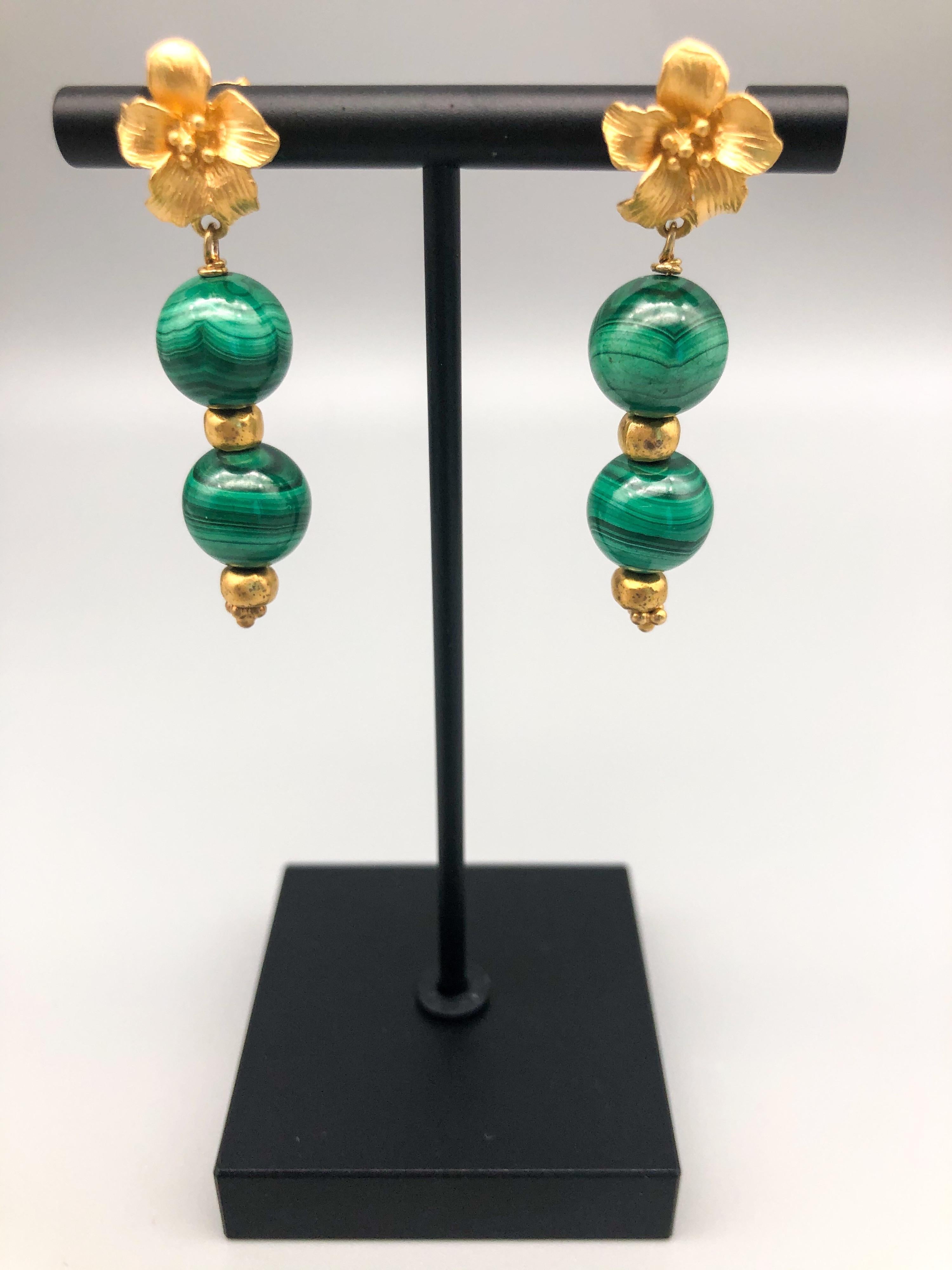 One-of-a-Kind

Double malachite beads dropped from a 22k on Sterling Silver (vermeil) lily.
These beautiful Malachite earrings will make a statement about you every time you wear them!