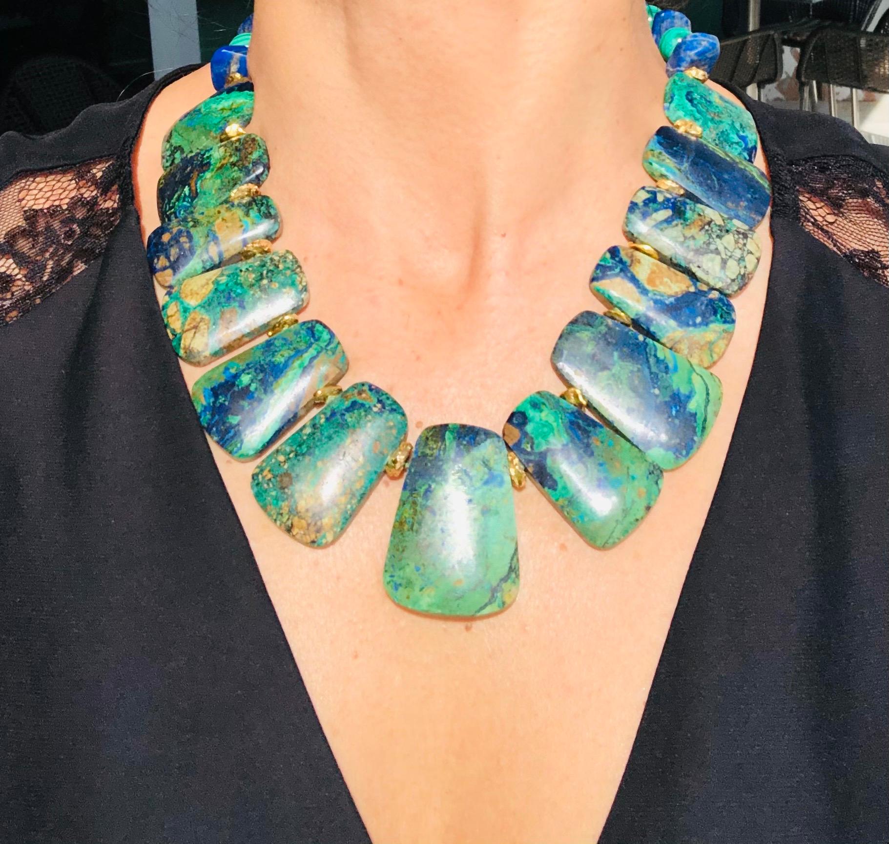 One-of-a-Kind

What a gift from the natural world is this matte-finished.
Indulge in the striking beauty of nature with this exquisite Malachite Collar necklace. Comprised of thirteen unique specimen stones, each showcasing a unique combination of