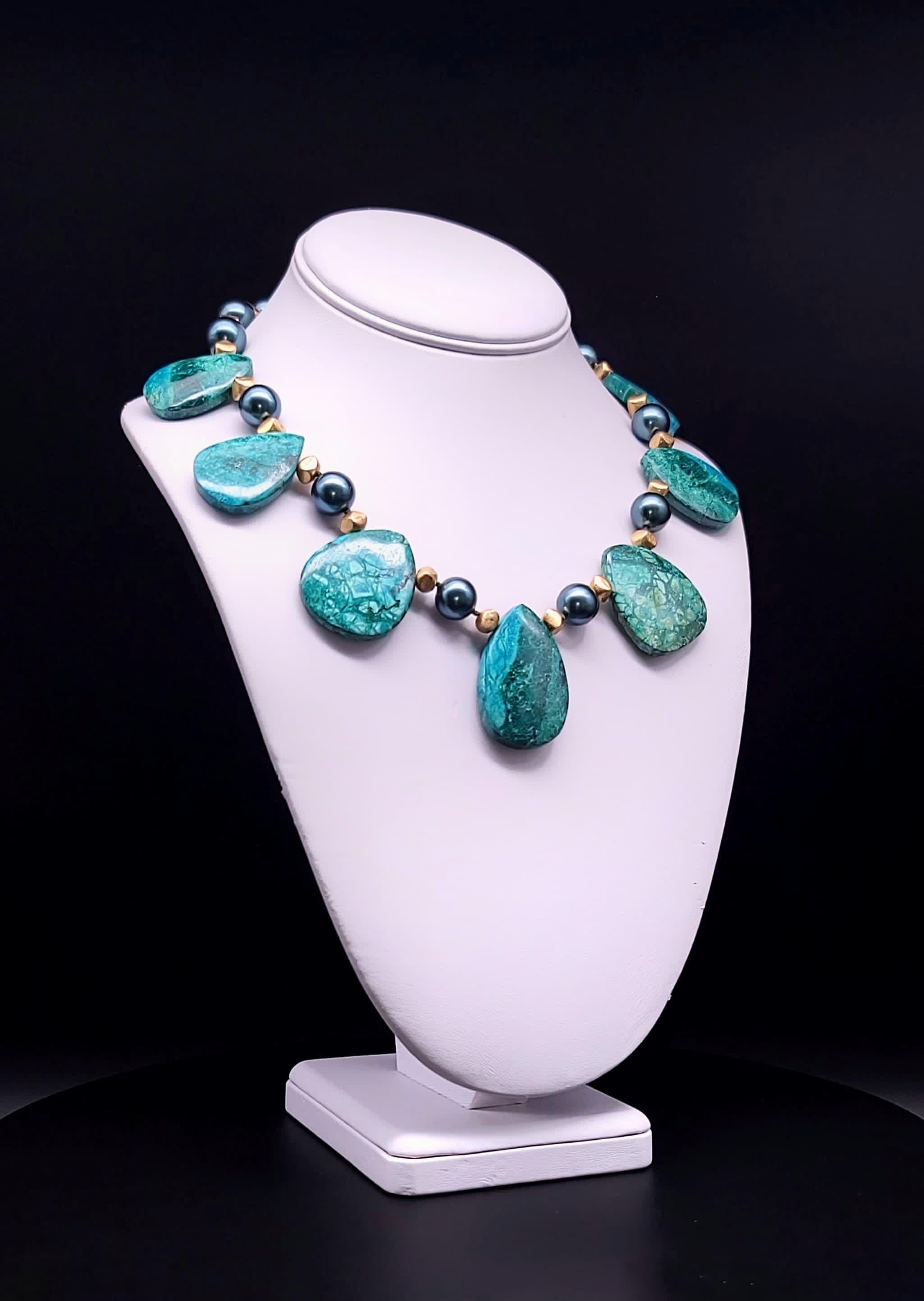 Introducing our captivating creation: the Dramatic and Bold Chrysocolla Oval Plates Necklace, a true one-of-a-kind masterpiece.

Crafted with meticulously polished Chrysocolla plates, each exuding its unique allure, this necklace is a celebration of