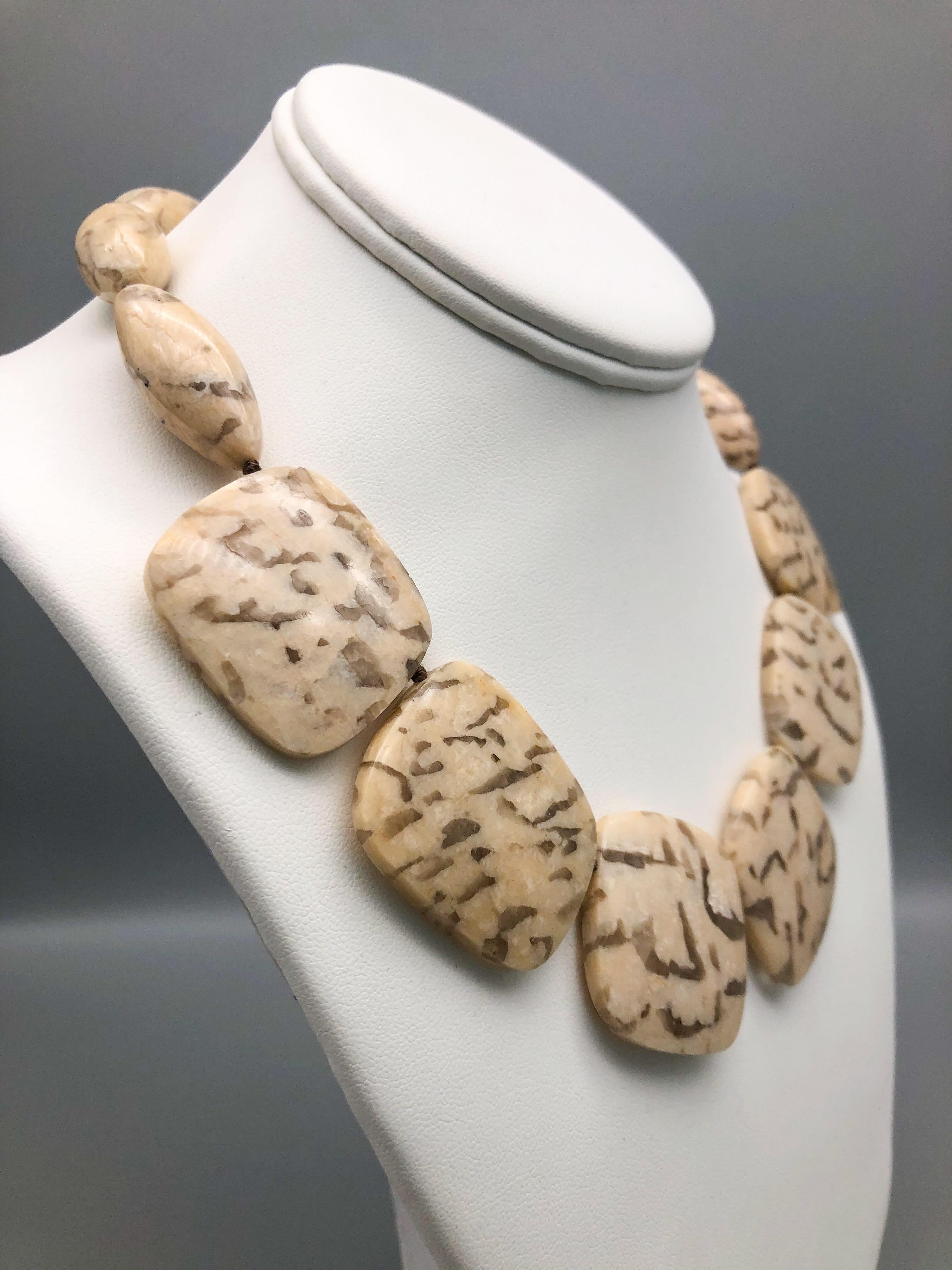 One-of-a-Kind

Can you feel the power in a.jeschel’s stone necklace? This unusual necklace of matched plates and beads is a conundrum. Two gemologists, both highly respected rock hounds, were arguing about what these stones were. One had identified