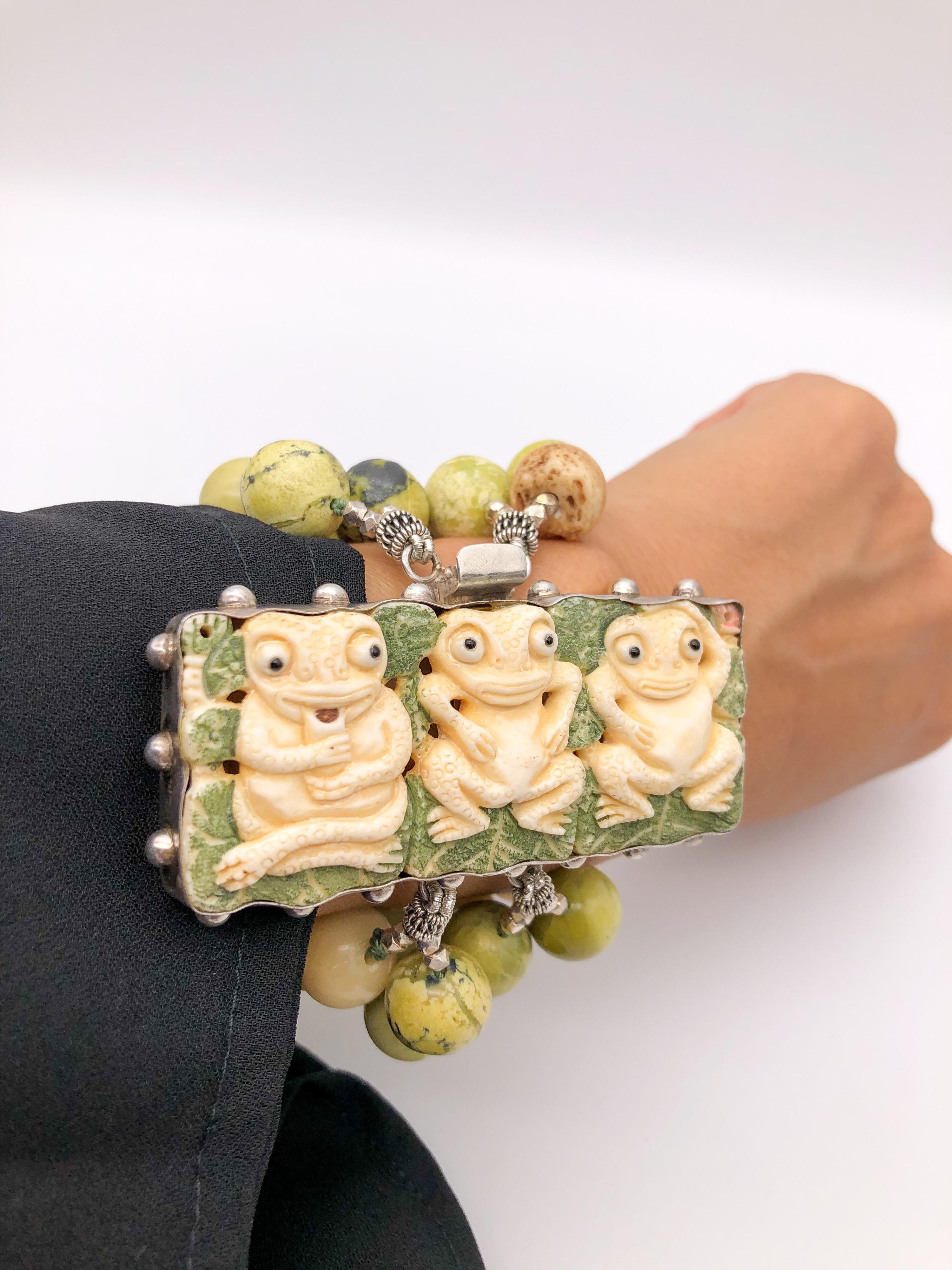 One-of-a-Kind
Statement bold bracelet, 4 strand Olive Jade gemstone is sure to delight with colors varying from a deep olive green to a light avocado. Fabulous carved 3 little frogs set on Sterling Silver clasp.
March birthstone.
Silk