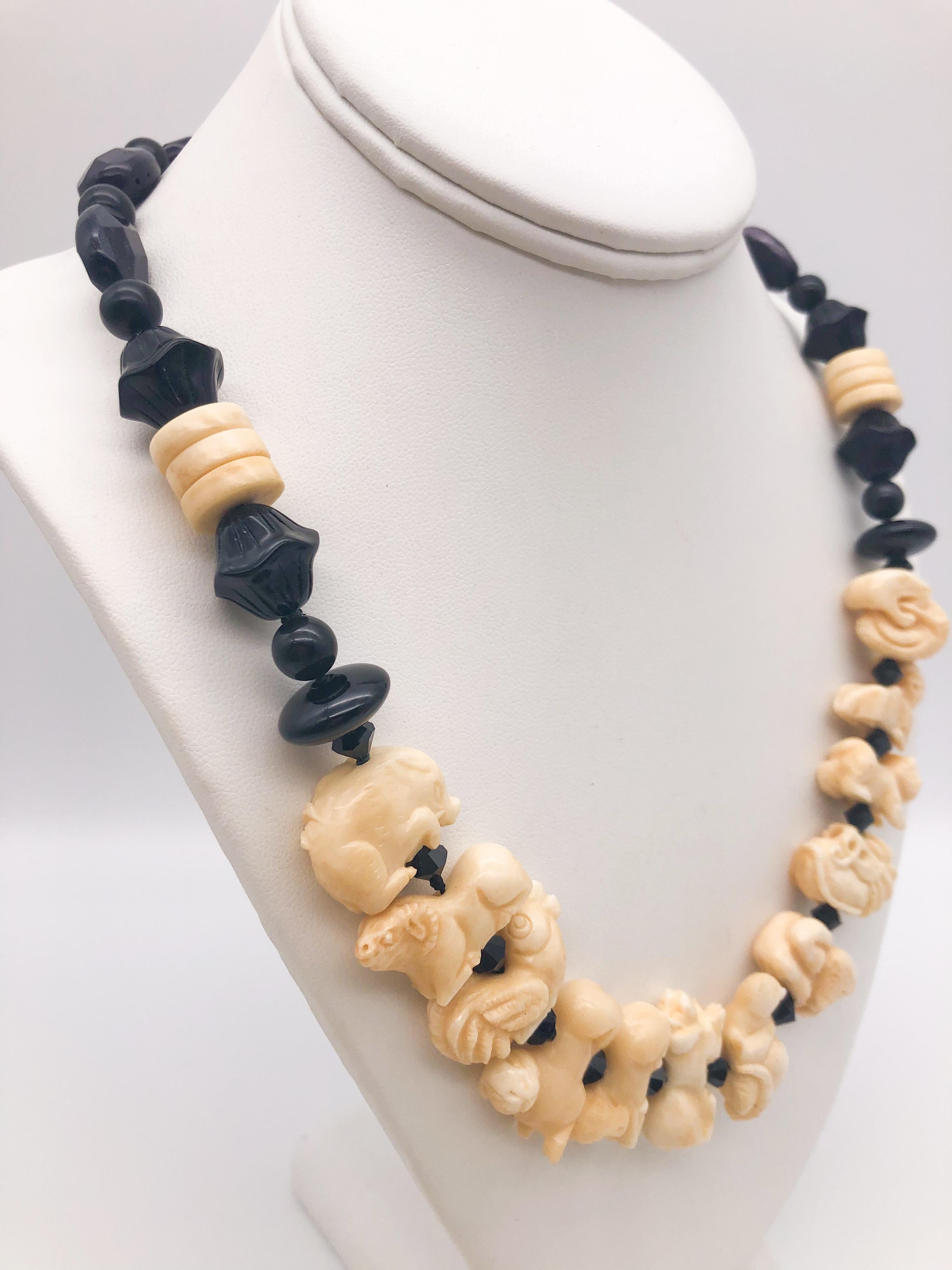 One-of-a-Kind
This necklace shows 12 individual zodiacs carved bone, representing each Chinese year of birth, Tiger, Hare, Dragon, Snake, Horse, Goat, Monkey, Cock, Dog, Boar, Rat, Ox. The animals are spaced with small onyx beads. Finished with Jet