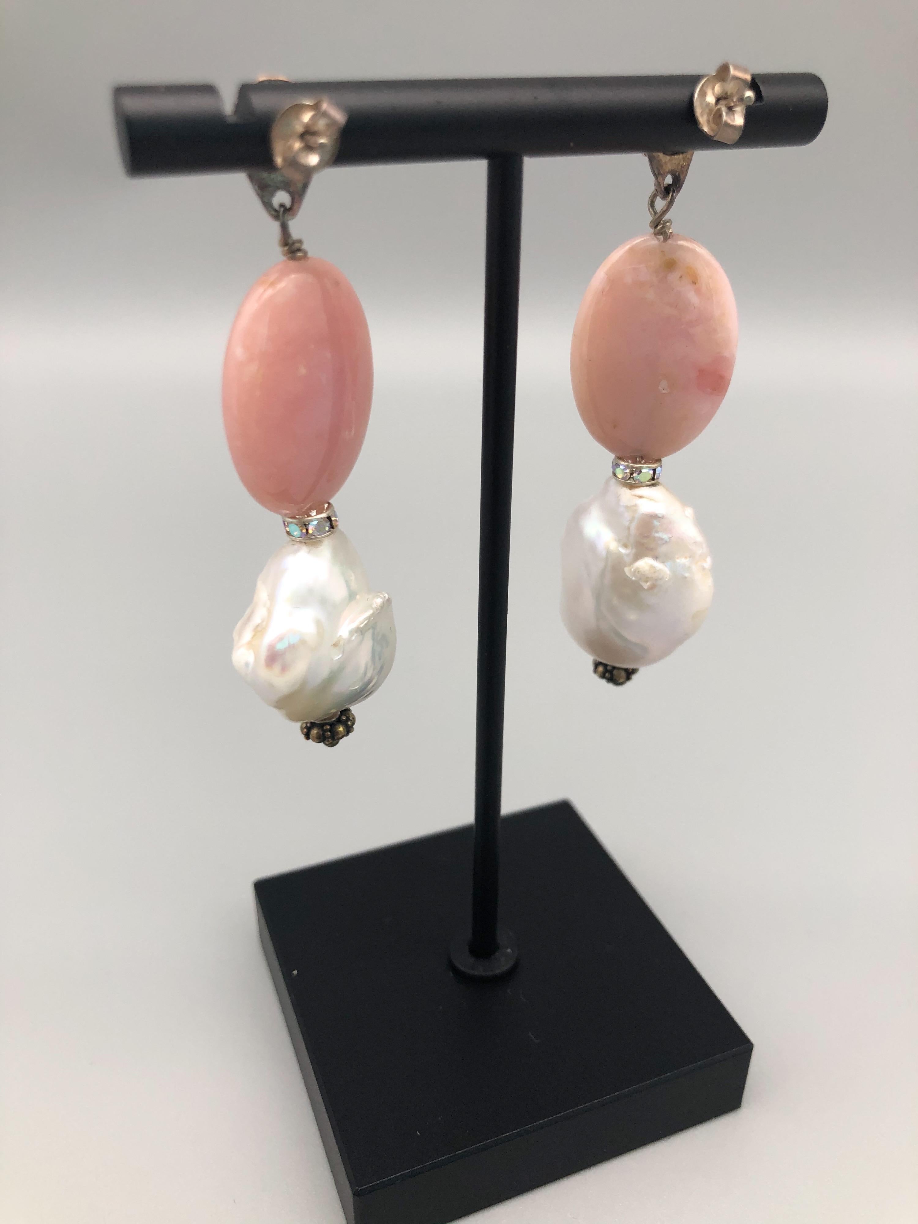 One-of-a-Kind

Polished Pink Opal with Baroque Pearls are dramatic and flattering. Sterling Silver posts.
.
