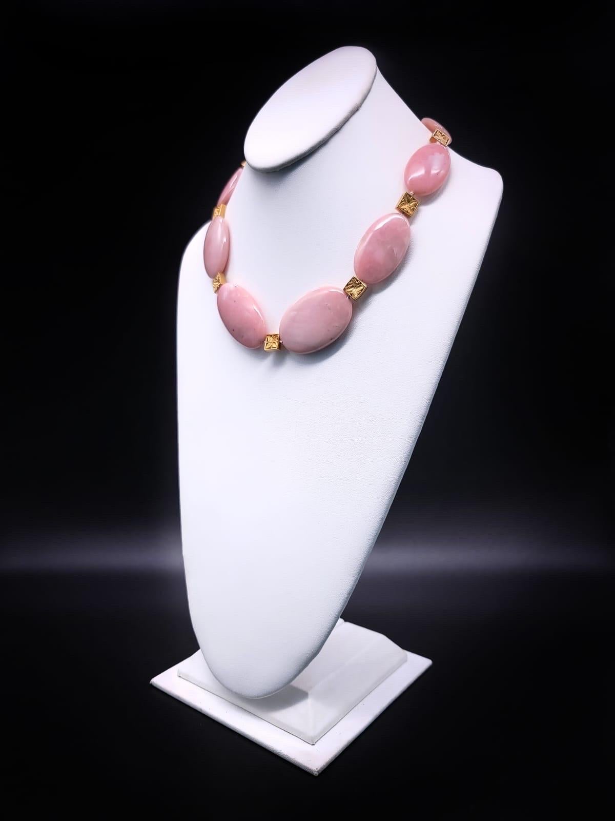 One-of-a-Kind

Indulge in the breathtaking allure of a truly one-of-a-kind accessory with our polished oval pink Peruvian opal necklace. Each opal bead boasts a captivating blush hue, reminiscent of the enchanting landscapes of the Andes. This